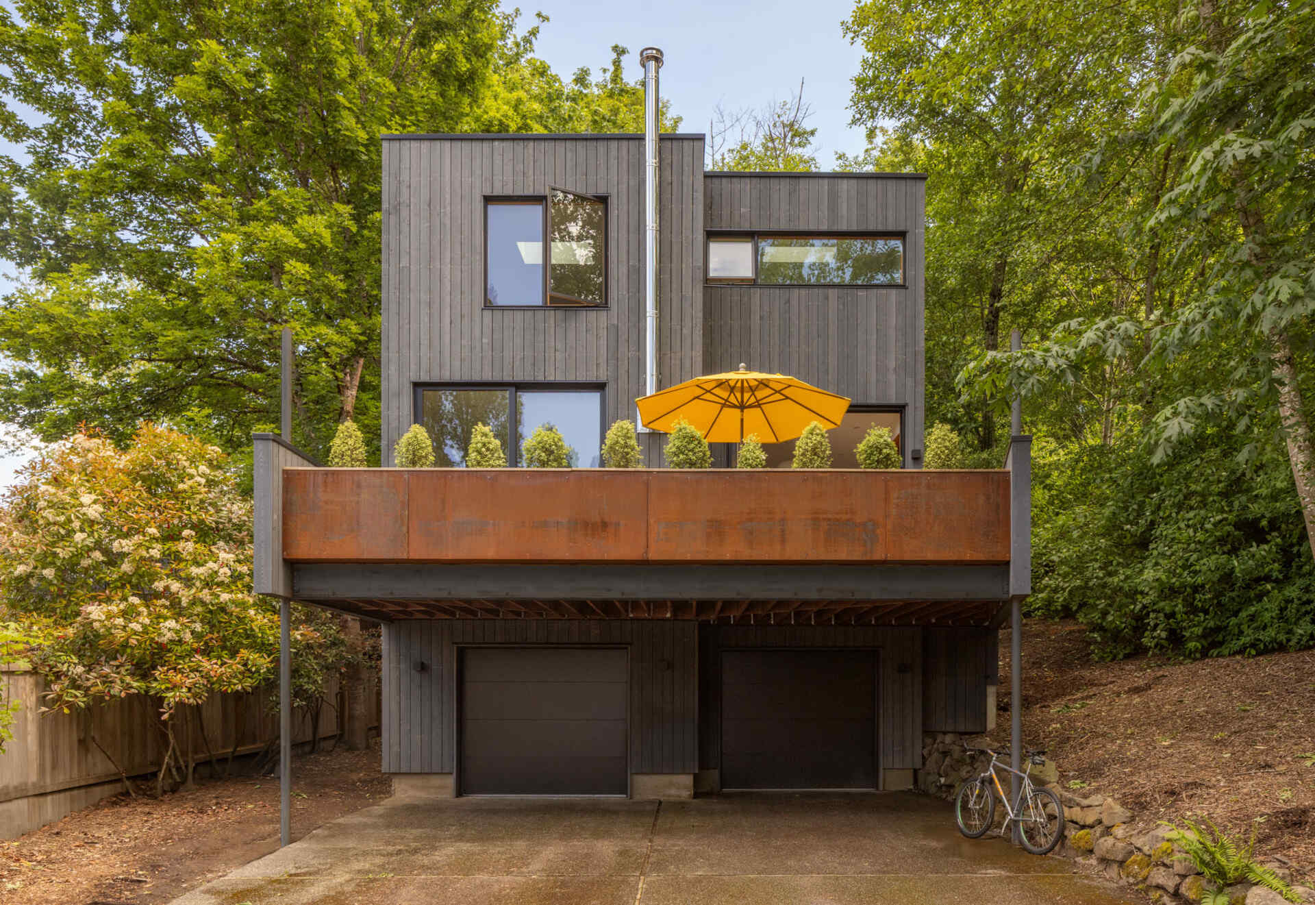 A calm modern update gives this Seattle home a stronger connection to its wooded surroundings with warm materials and Passive House thinking.