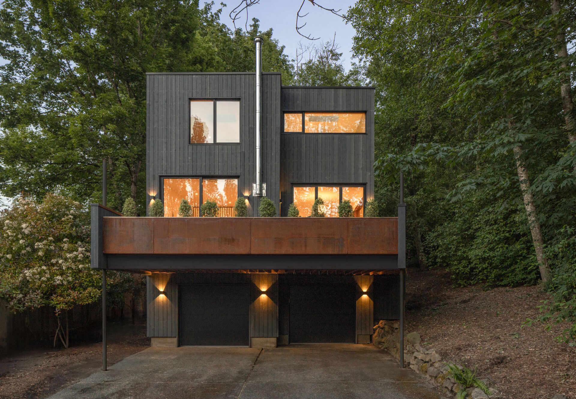 A calm modern update gives this Seattle home a stronger connection to its wooded surroundings with warm materials and Passive House thinking.