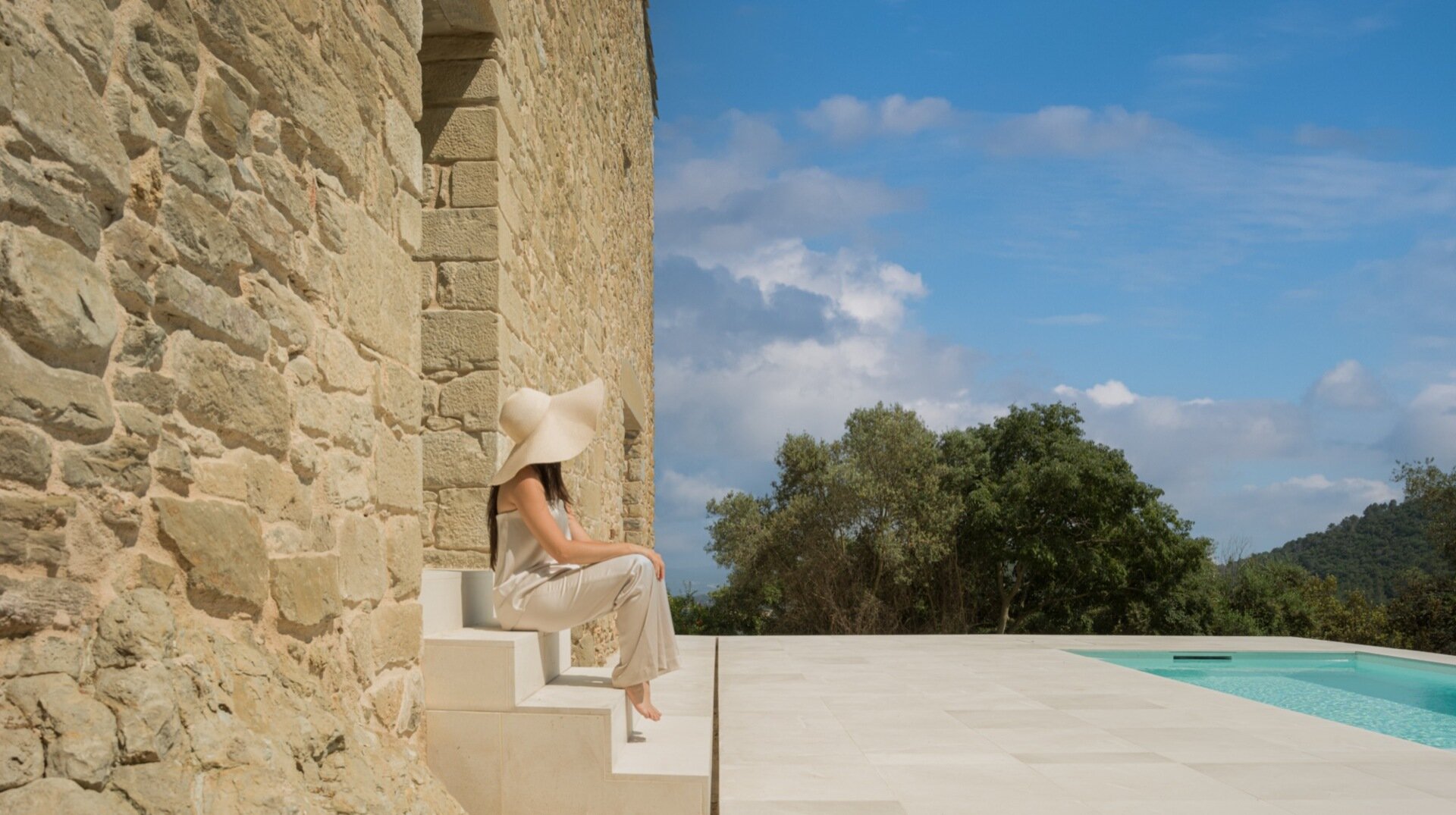 Carved from an old cistern, the pool at Mas Cadalt reflects the surrounding landscape like glass, a peaceful blend of history, sustainability, and quiet elegance.