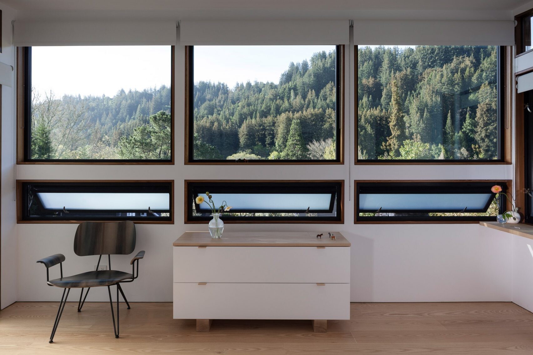 The primary bedroom suite combines large windows, built-in storage, and a bright ensuite with porcelain tiles for a serene retreat.