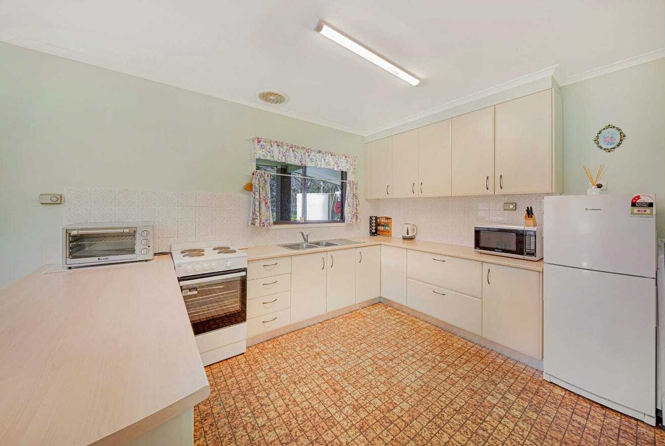 BEFORE THE RENOVATION - An untouched 1960s home that once felt dark and closed off from its incredible mountain surroundings.