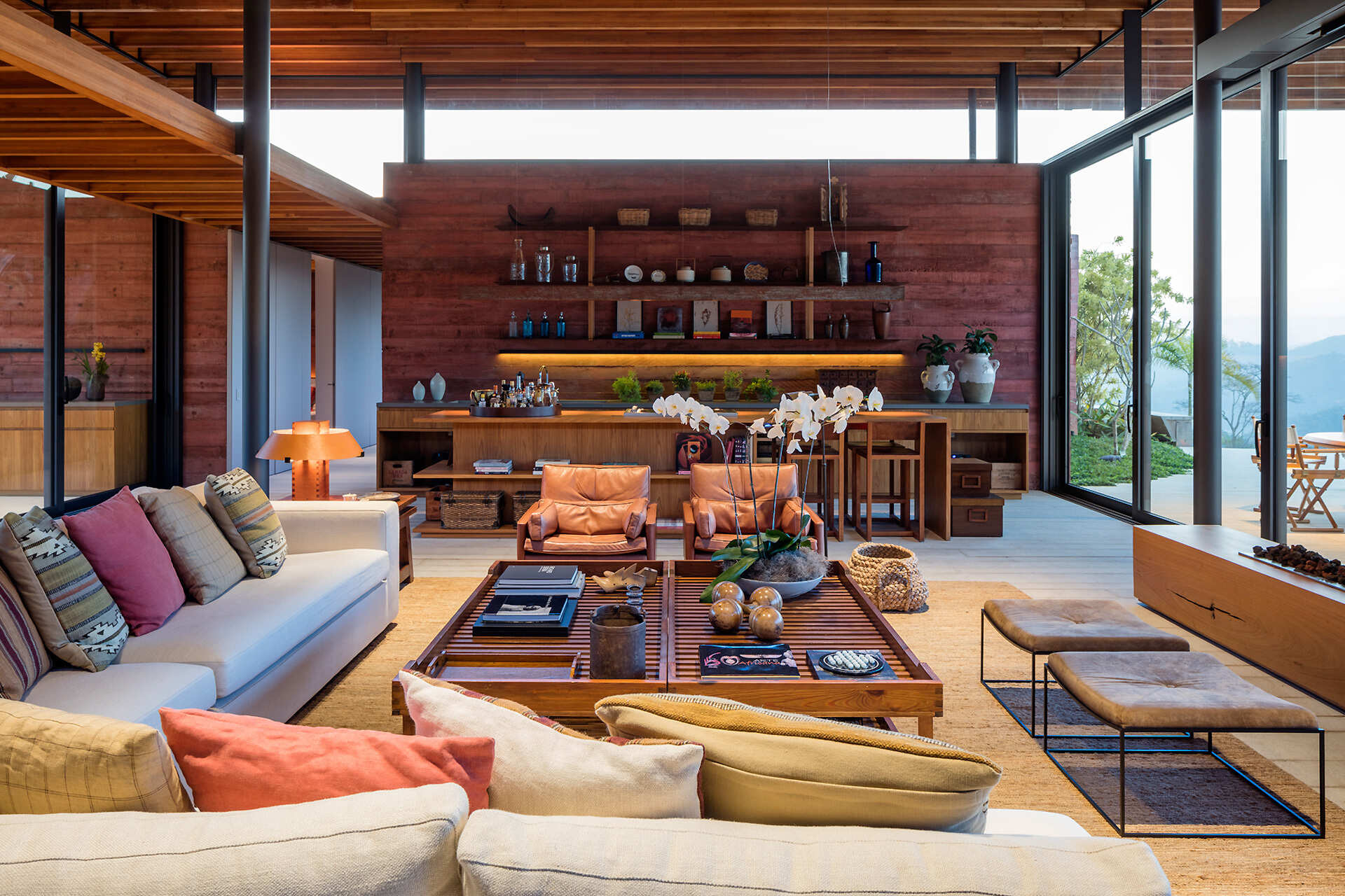 Pigmented concrete walls bring colour and texture to the living, dining, and bar areas inside Casa Terra.