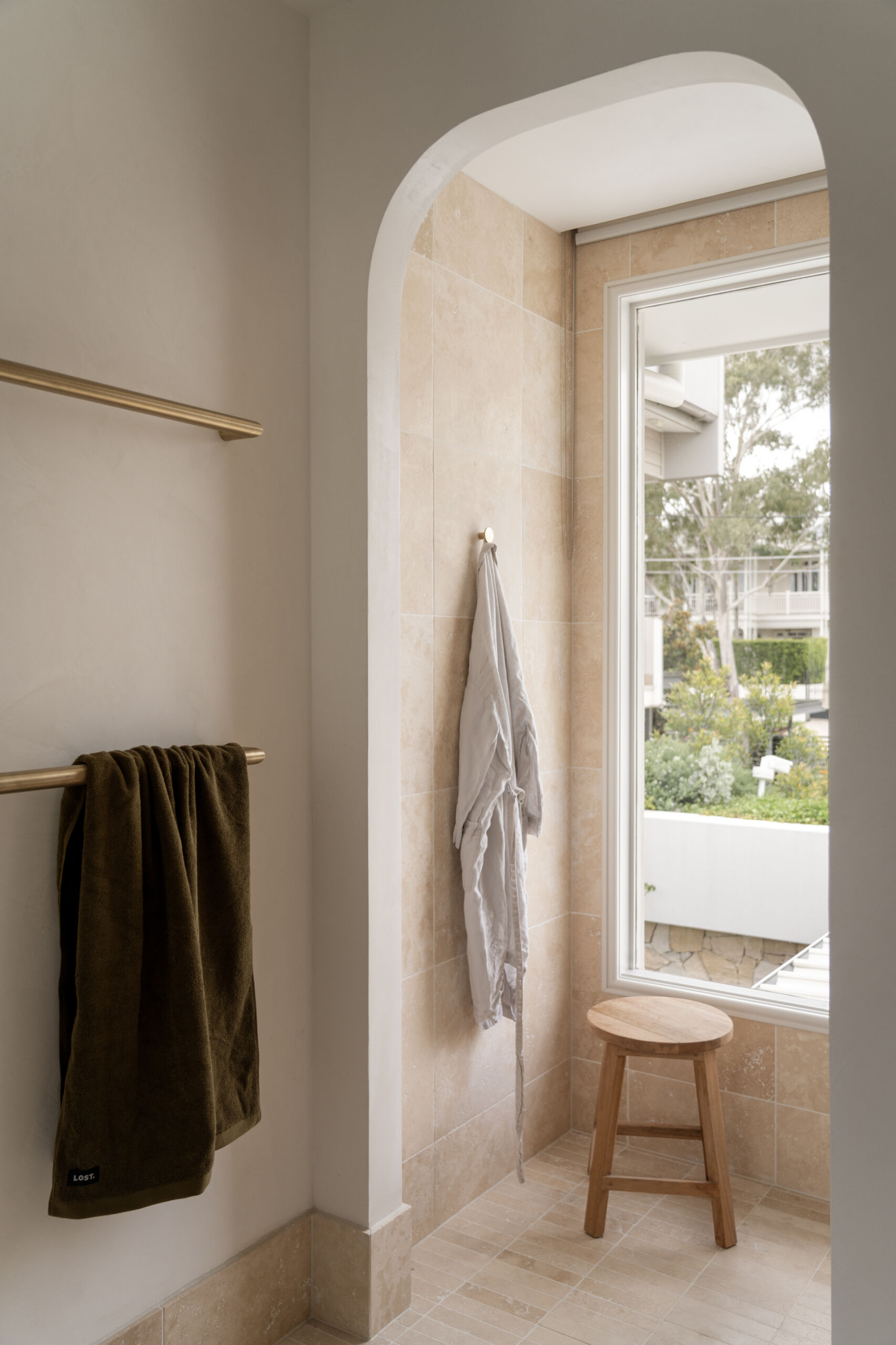 Modern guest bathroom with Travertine details.