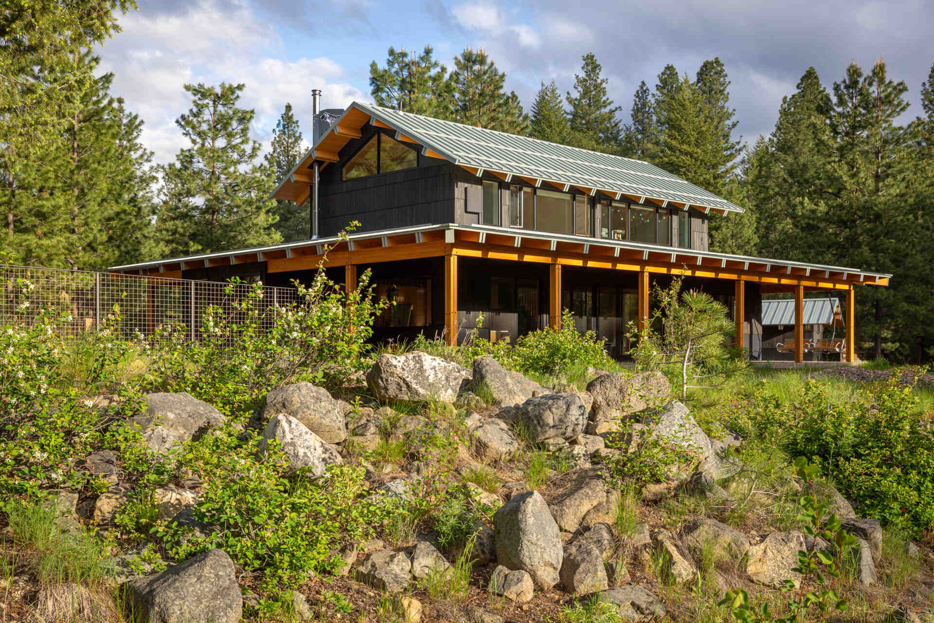 Set on a river-meandering site in the Methow Valley, this home blends classic lodge architecture with refined Japanese detailing, shaped by light, landscape, and sun-conscious design.