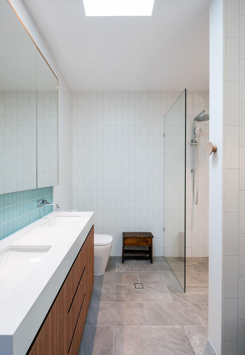 Skylights and turquoise tiles bring light and character into this bathroom.