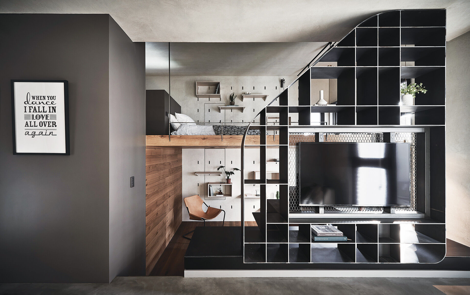 A small Taipei apartment transformed through height, movement, and multi-functional furniture, showing how design can maximize limited space.