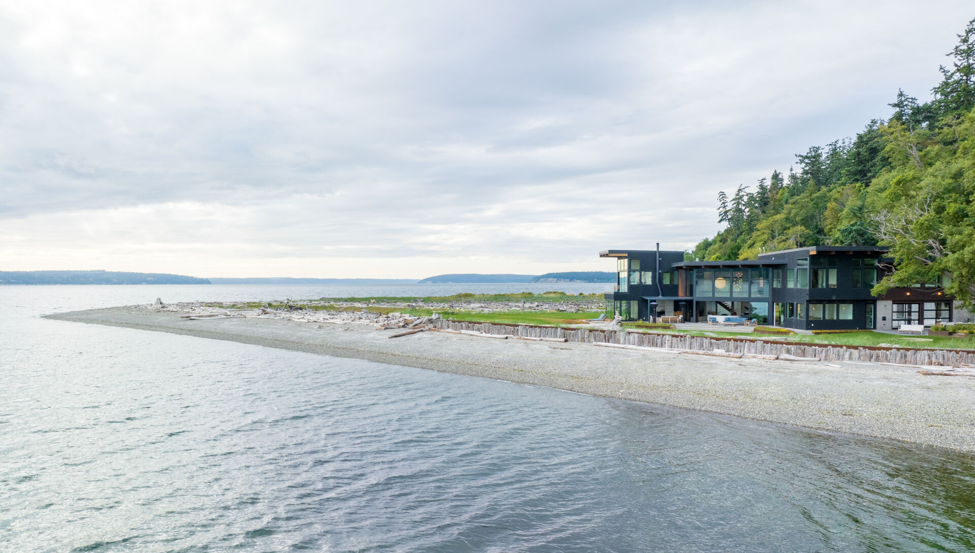 This coastal home shows how architecture can respond directly to land, regulation, and risk. Designed within an existing footprint, the form reflects shoreline rules, steep slopes, and long term durability in a marine environment.