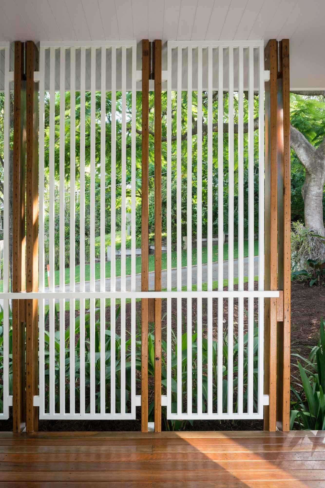 A built-in window seat and private outdoor space make the main bedroom feel calm and connected to the garden.