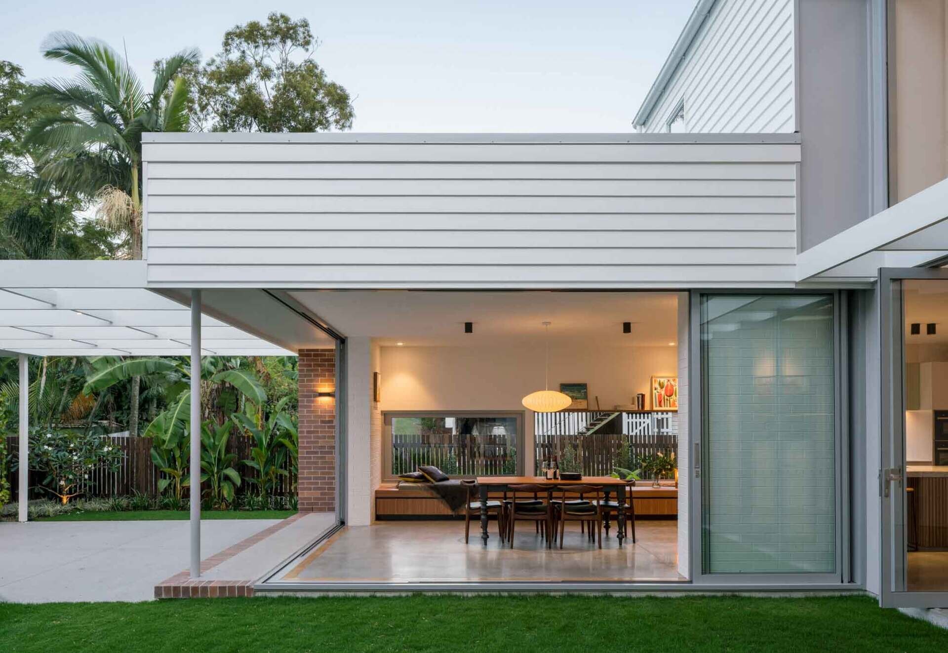 Ground floor living spaces open directly to outdoor areas designed for everyday family life.