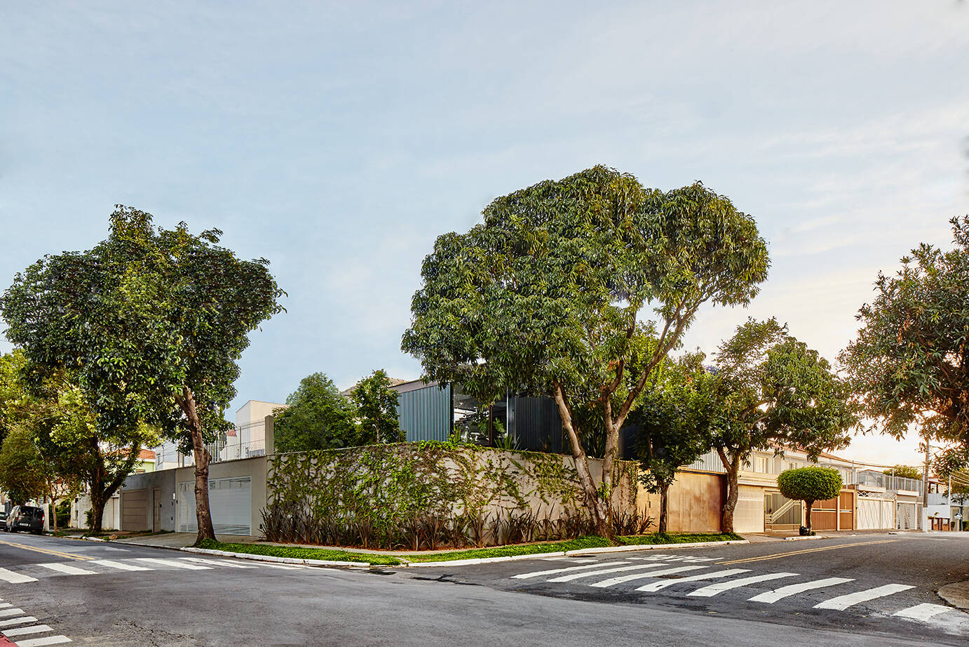 A concrete box hidden behind walls shows how an architect designed his own home to prioritize privacy in São Paulo.