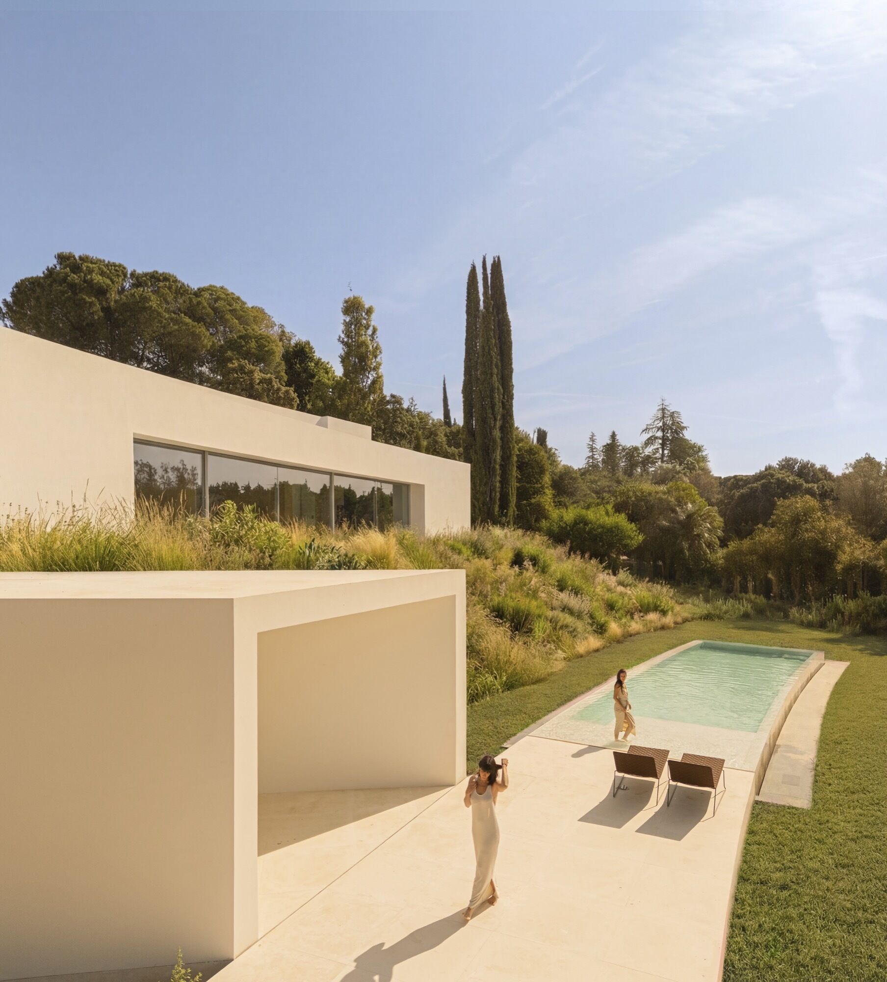 The swimming pool sits on the lowest level of the house, anchoring the start of the ascending architectural layout.