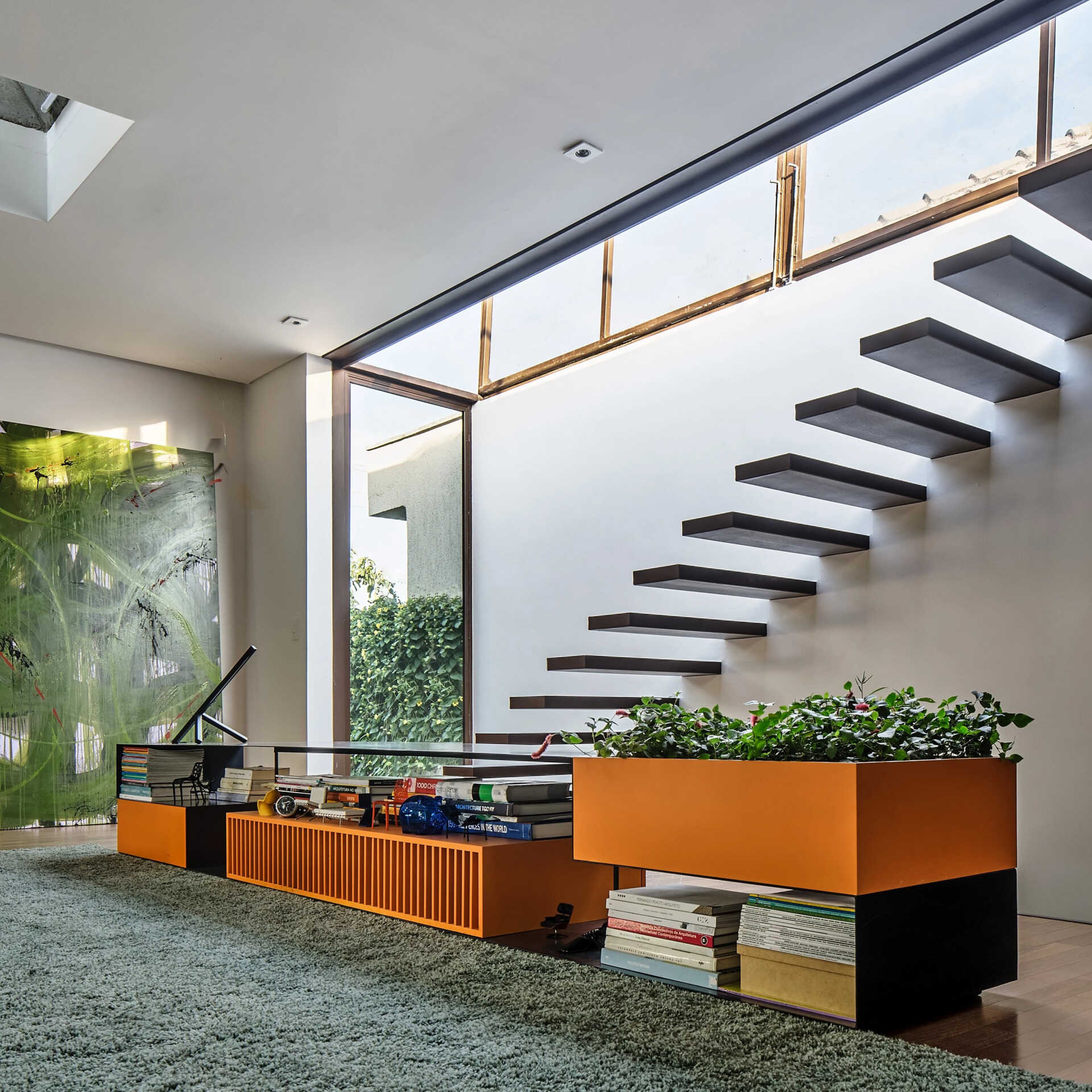 The stairs in this modern house lead up to the rooftop deck.