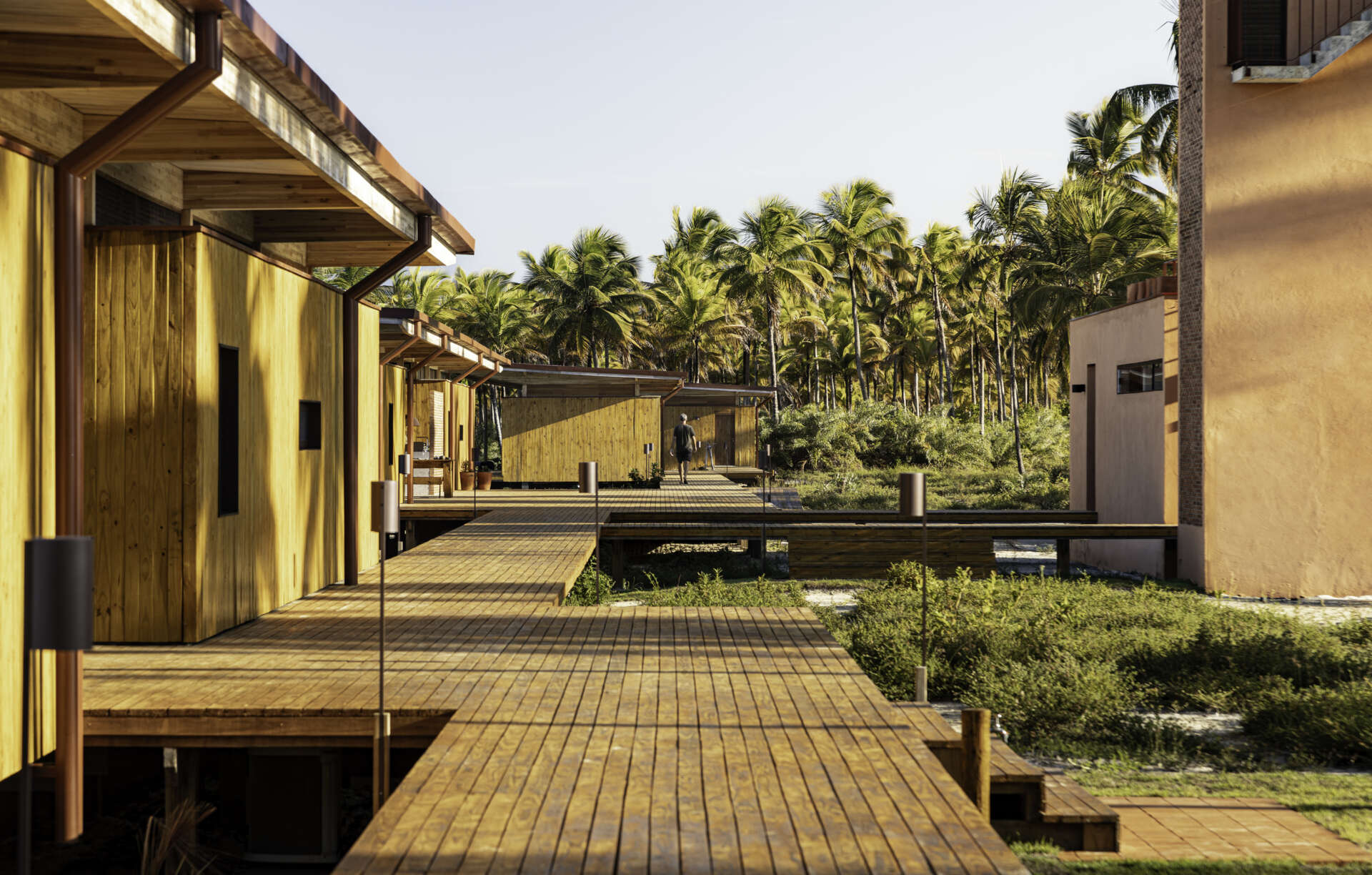 A modular home set between the river and the sea, designed for calm tropical living. Warm wood interiors, large glass openings, and open patios create a seamless flow between forest, coast, and indoor comfort.