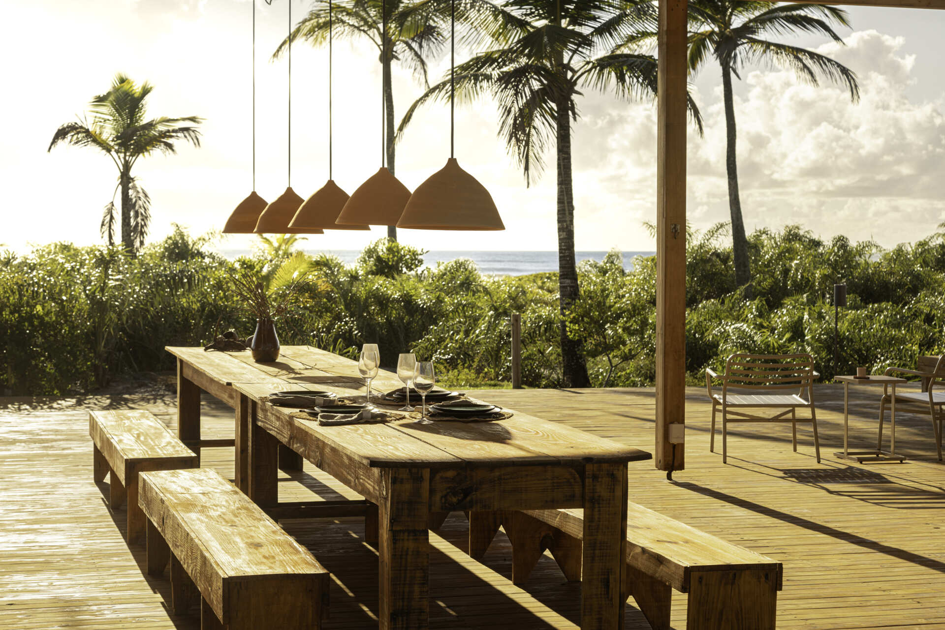 A modular home set between the river and the sea, designed for calm tropical living. Warm wood interiors, large glass openings, and open patios create a seamless flow between forest, coast, and indoor comfort.