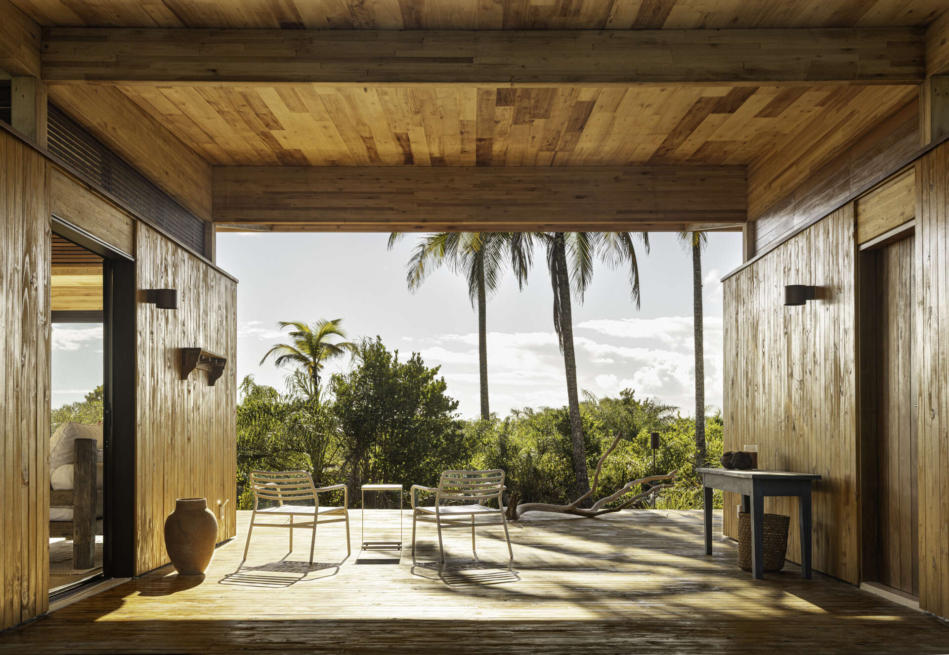 A modular home set between the river and the sea, designed for calm tropical living. Warm wood interiors, large glass openings, and open patios create a seamless flow between forest, coast, and indoor comfort.