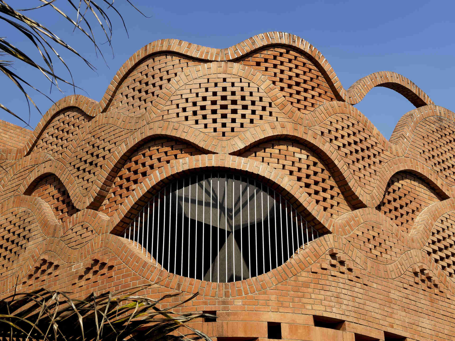 See how Gadi House uses sculpted brickwork to connect modern living with Maratha heritage in a home designed as both fortress and family haven.