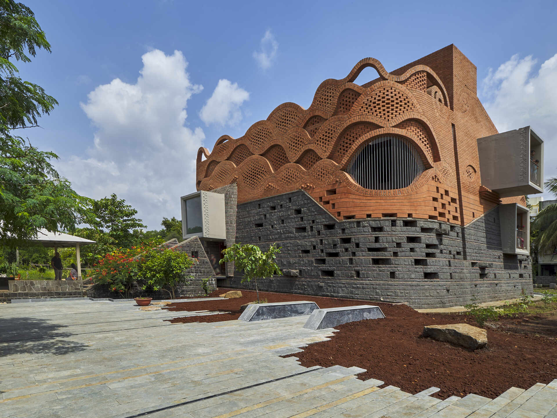 See how Gadi House uses sculpted brickwork to connect modern living with Maratha heritage in a home designed as both fortress and family haven.