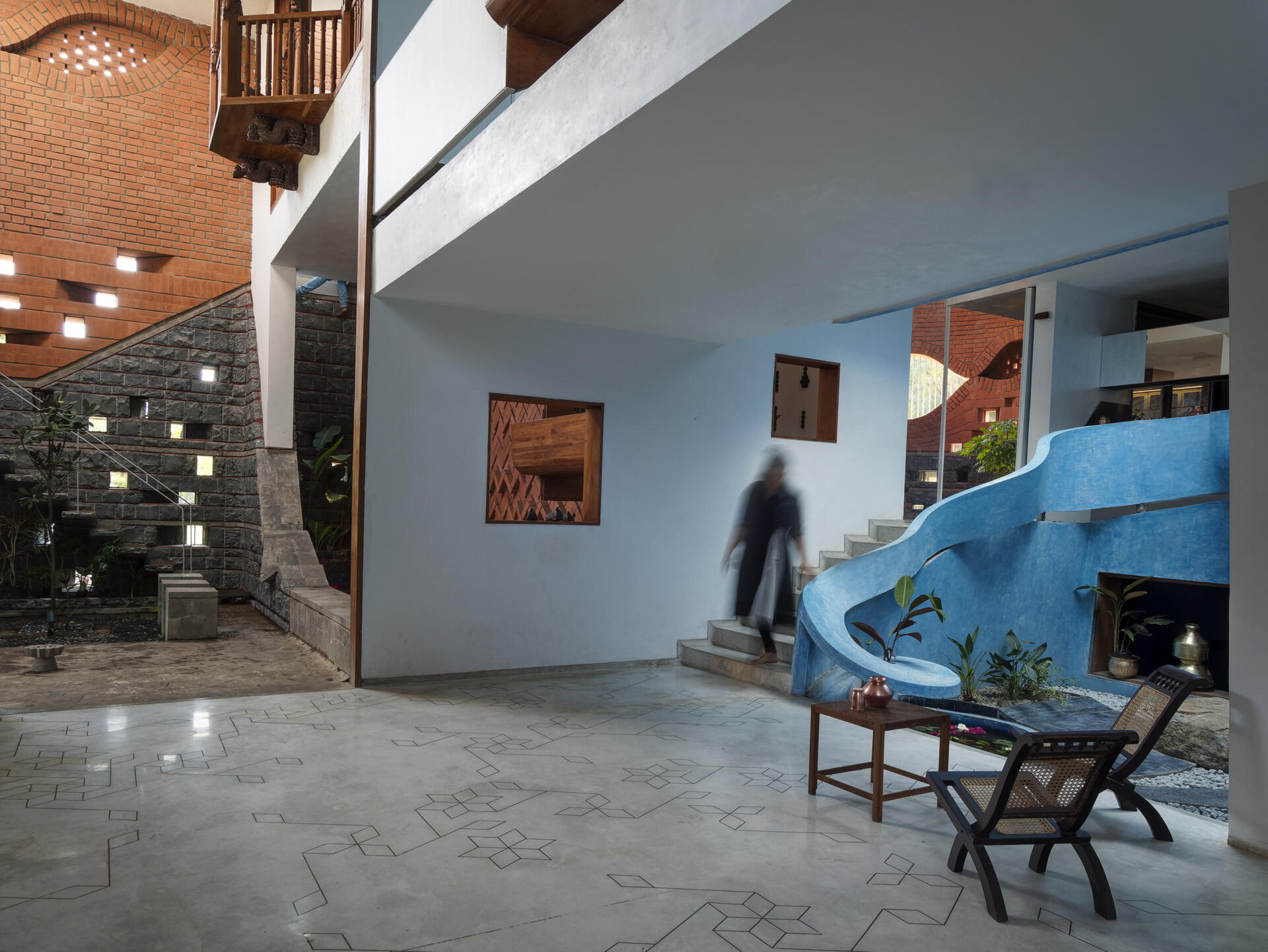 Step inside calm, seamless interiors finished in traditional lime stucco that balance the textured brick exterior.