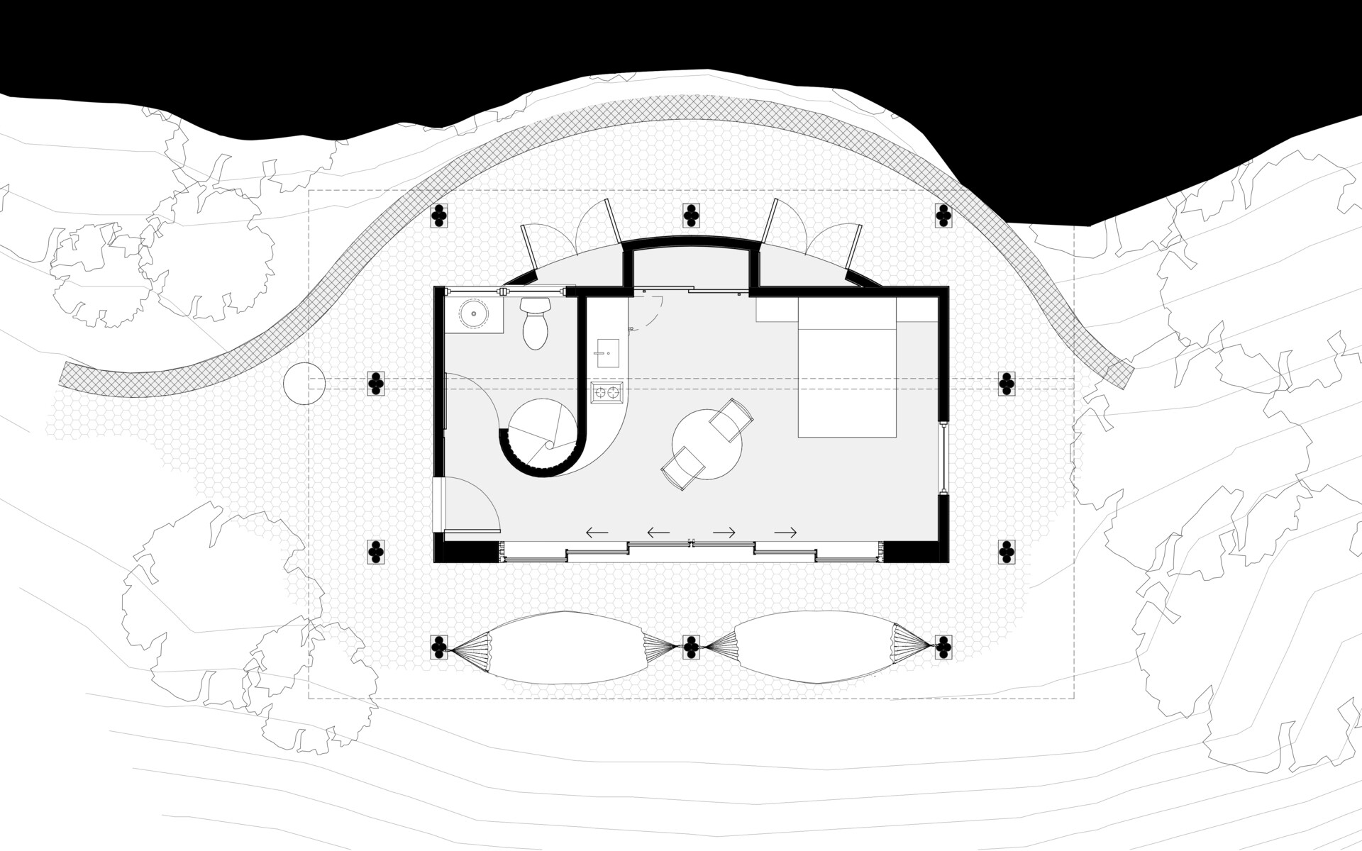 This Colombian home reimagines rural architecture with a butterfly roof that collects rainwater, bamboo-and-steel structural details, and an open interior where the bedroom, kitchenette, and a hidden curved-wall bathroom blend seamlessly, creating a sustainable, modern, and deeply connected living experience.