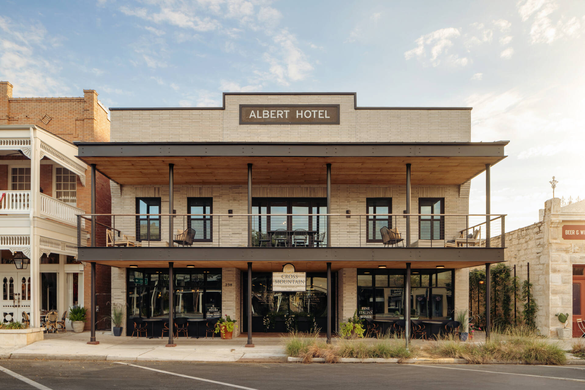 Historic streetfront buildings remain intact while new hotel architecture is quietly positioned behind, preserving the rhythm of downtown Fredericksburg.