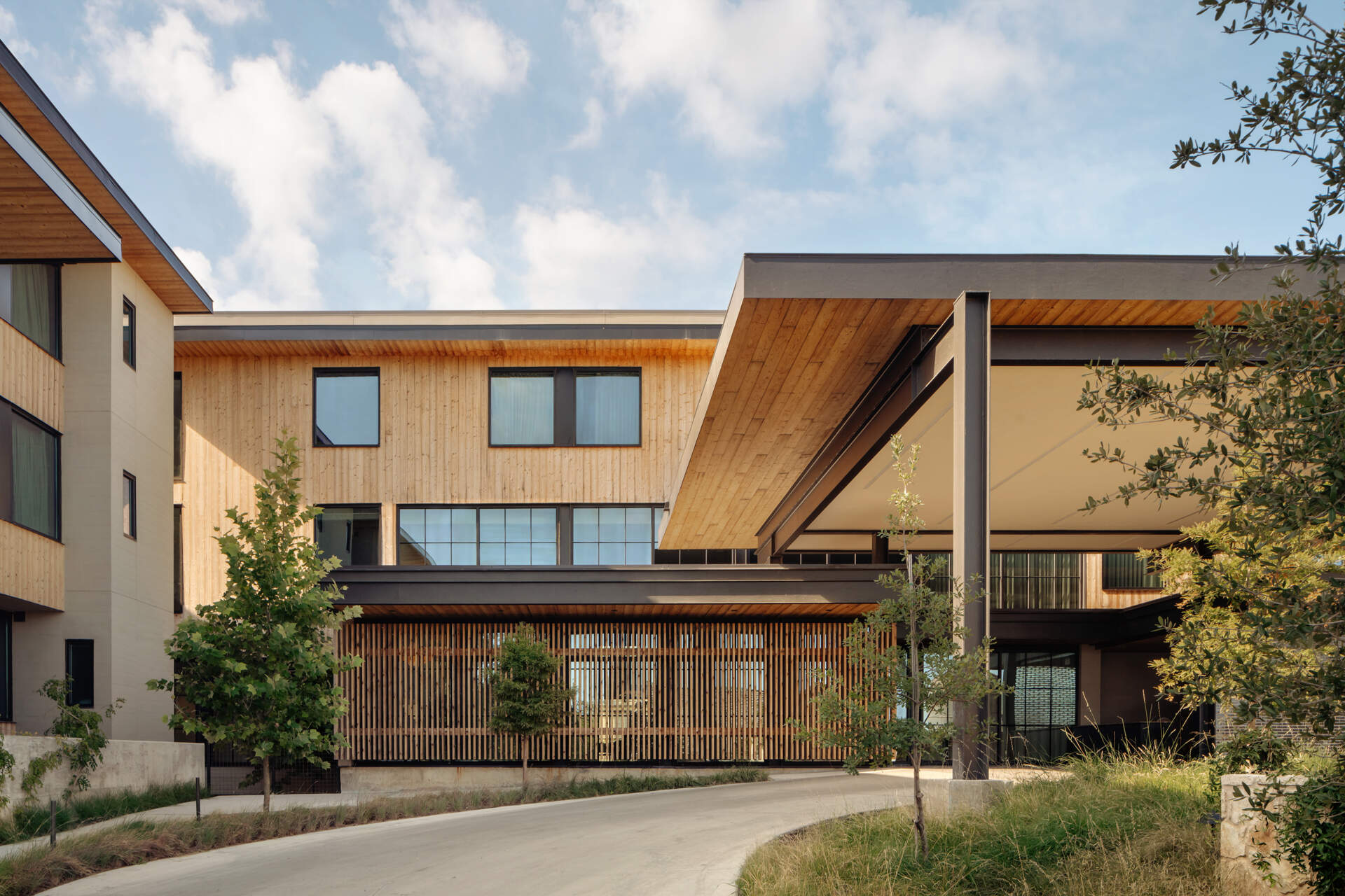 Historic streetfront buildings remain intact while new hotel architecture is quietly positioned behind, preserving the rhythm of downtown Fredericksburg.