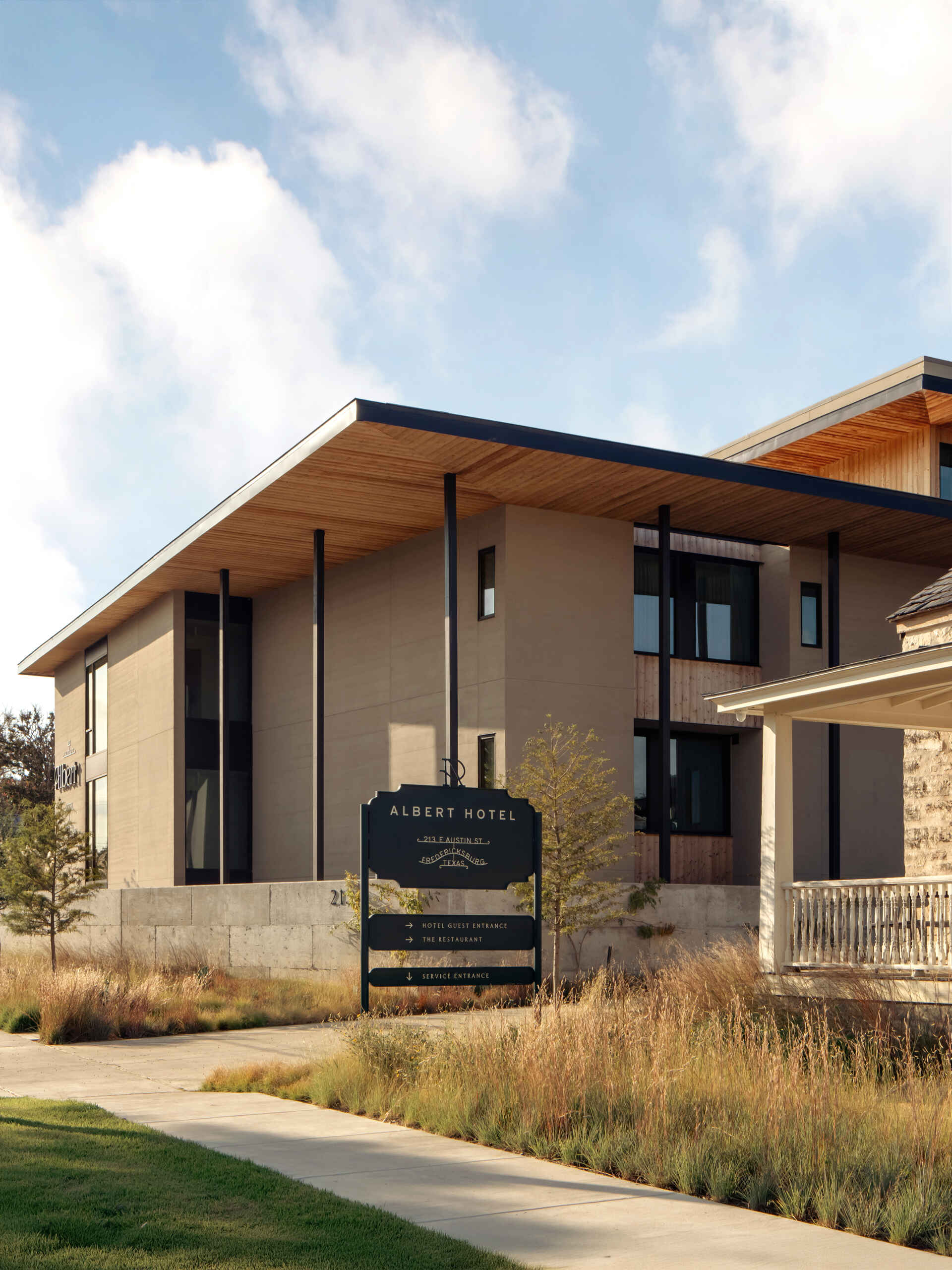 Historic streetfront buildings remain intact while new hotel architecture is quietly positioned behind, preserving the rhythm of downtown Fredericksburg.
