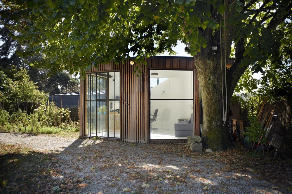 A compact backyard studio designed by JCPCDR Architecture for a composer seeking a quiet workspace in the countryside.