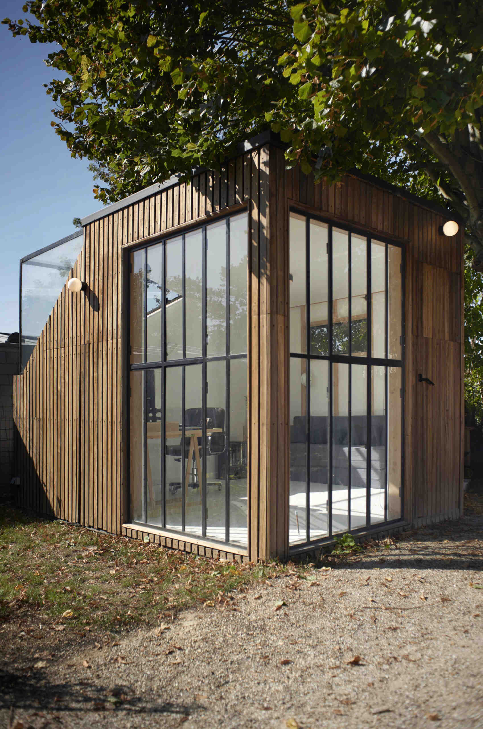 A compact backyard studio designed by JCPCDR Architecture for a composer seeking a quiet workspace in the countryside.