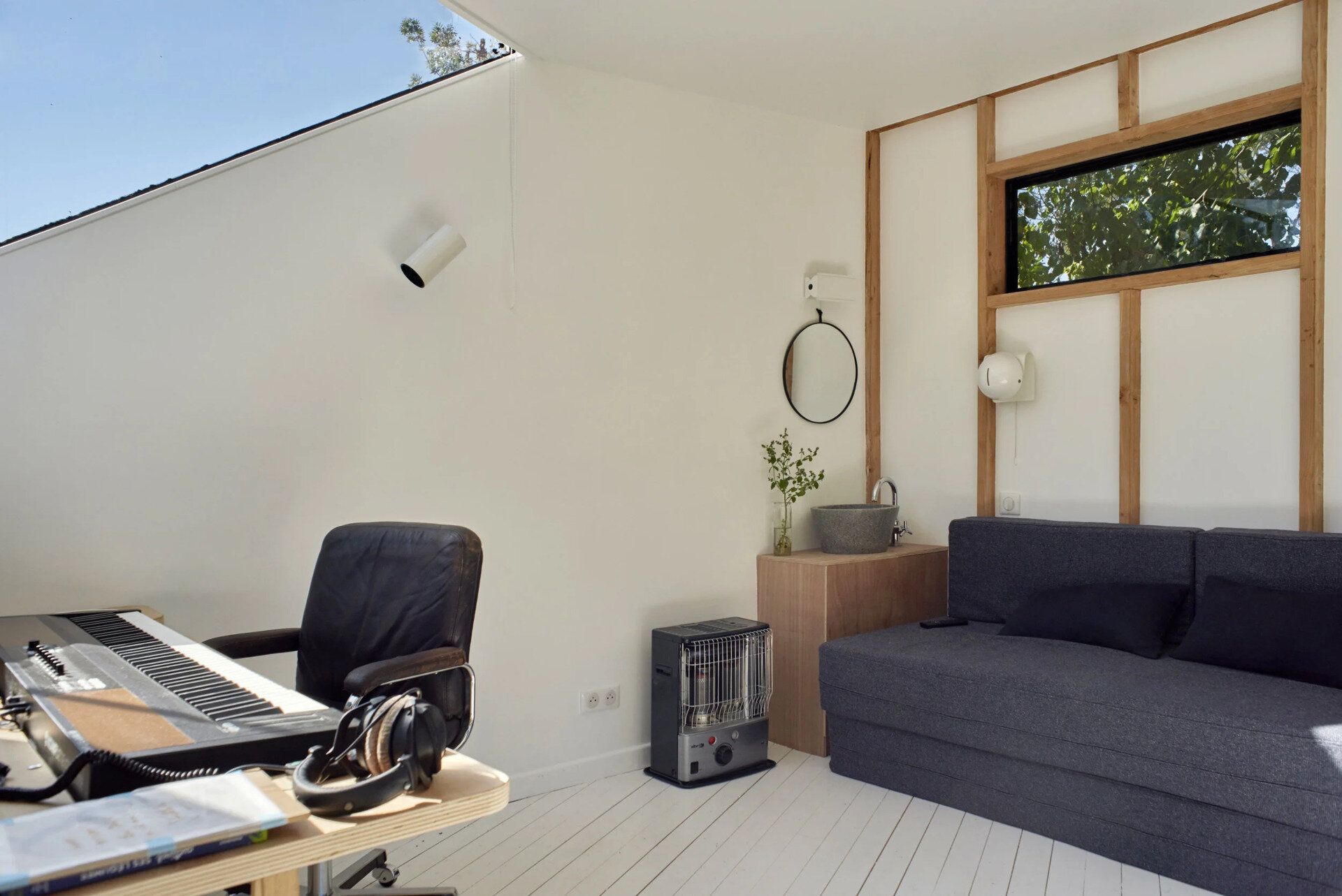 A compact backyard studio designed by JCPCDR Architecture for a composer seeking a quiet workspace in the countryside.