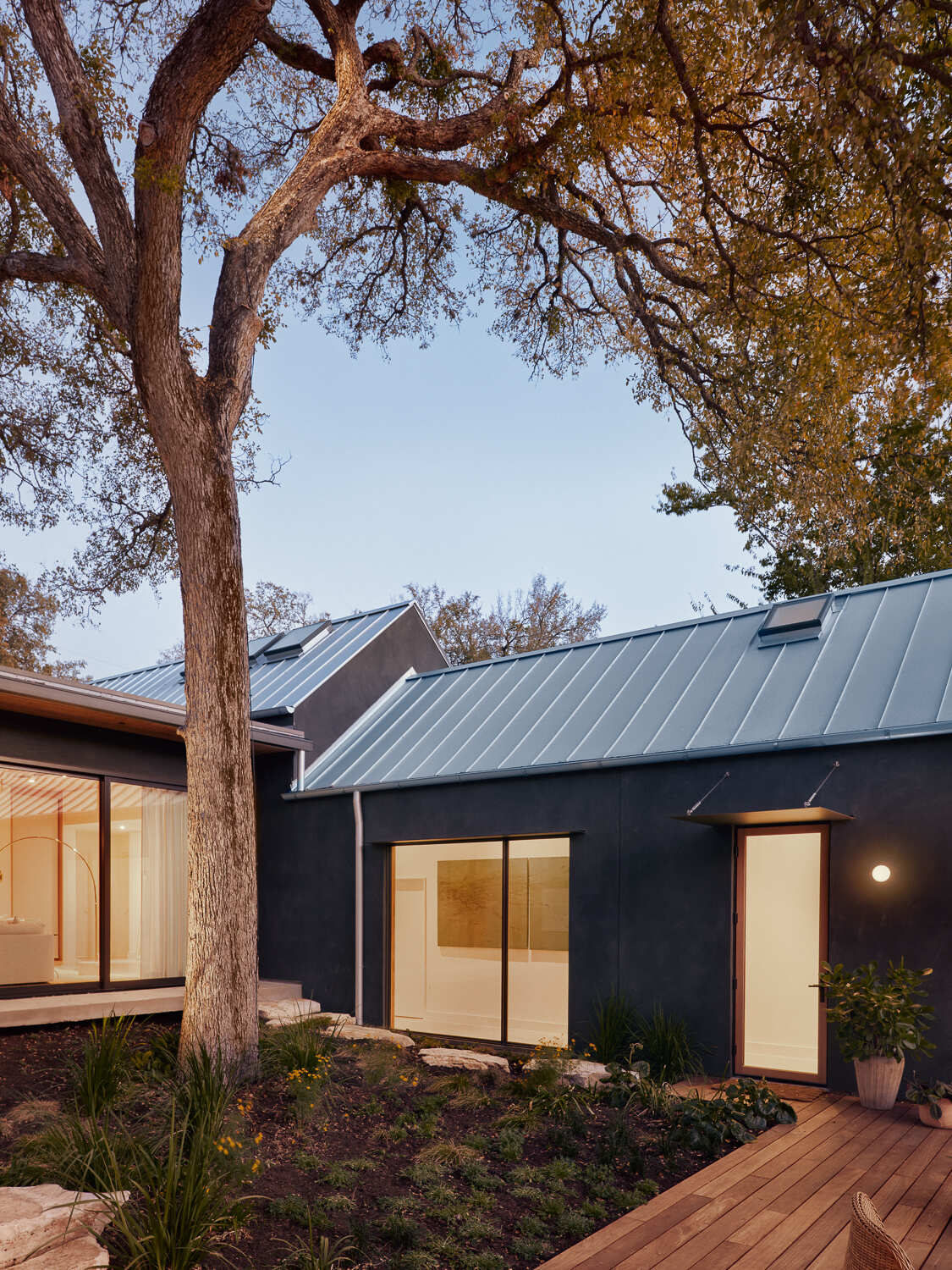 A new addition designed to sit in contrast with the restored historic structure. Rather than mimic the original bungalow, the addition creates an architectural juxtaposition that looks forward while still respecting the home’s past.