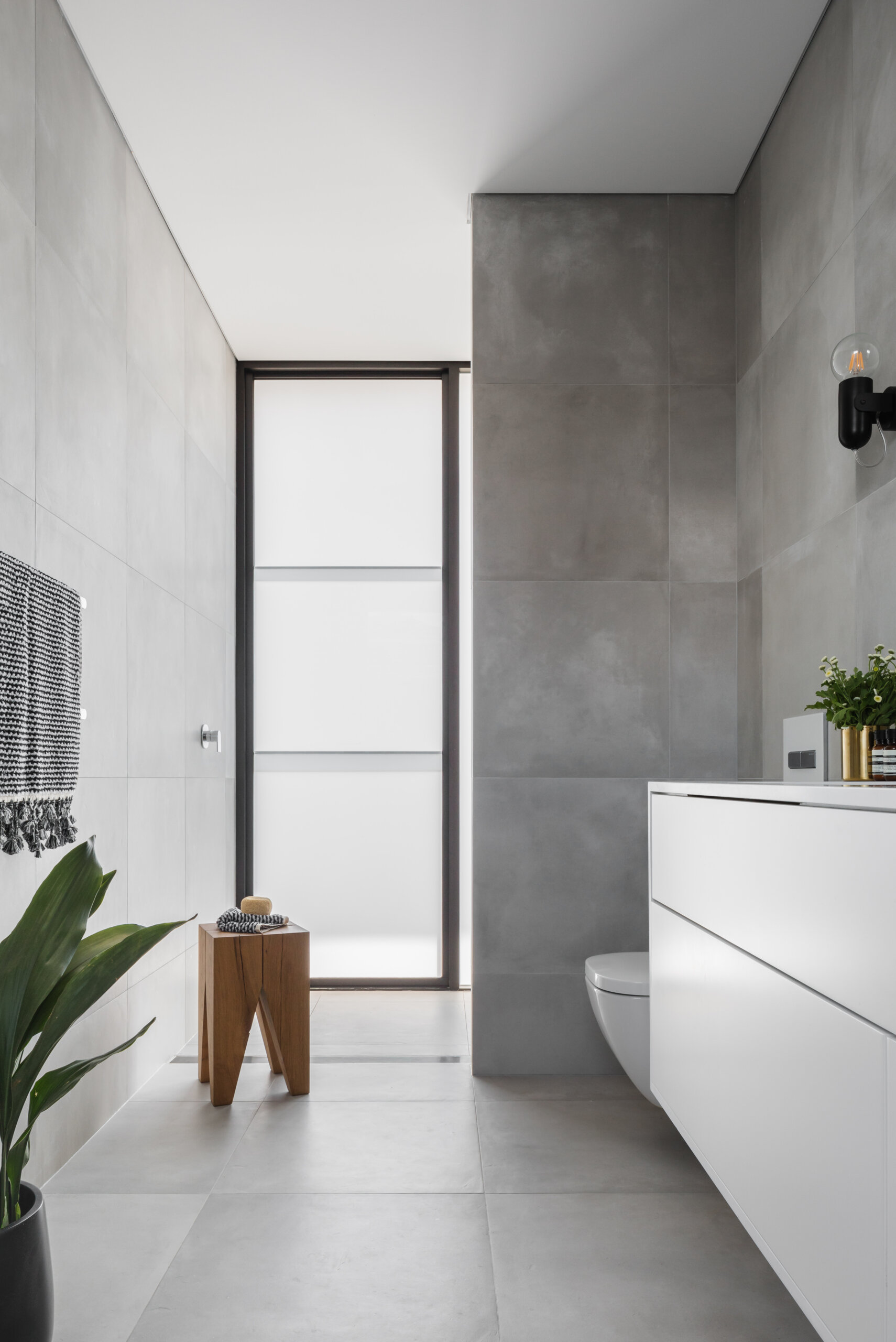 A grey and white bathroom design delivers a calm and modern feel.