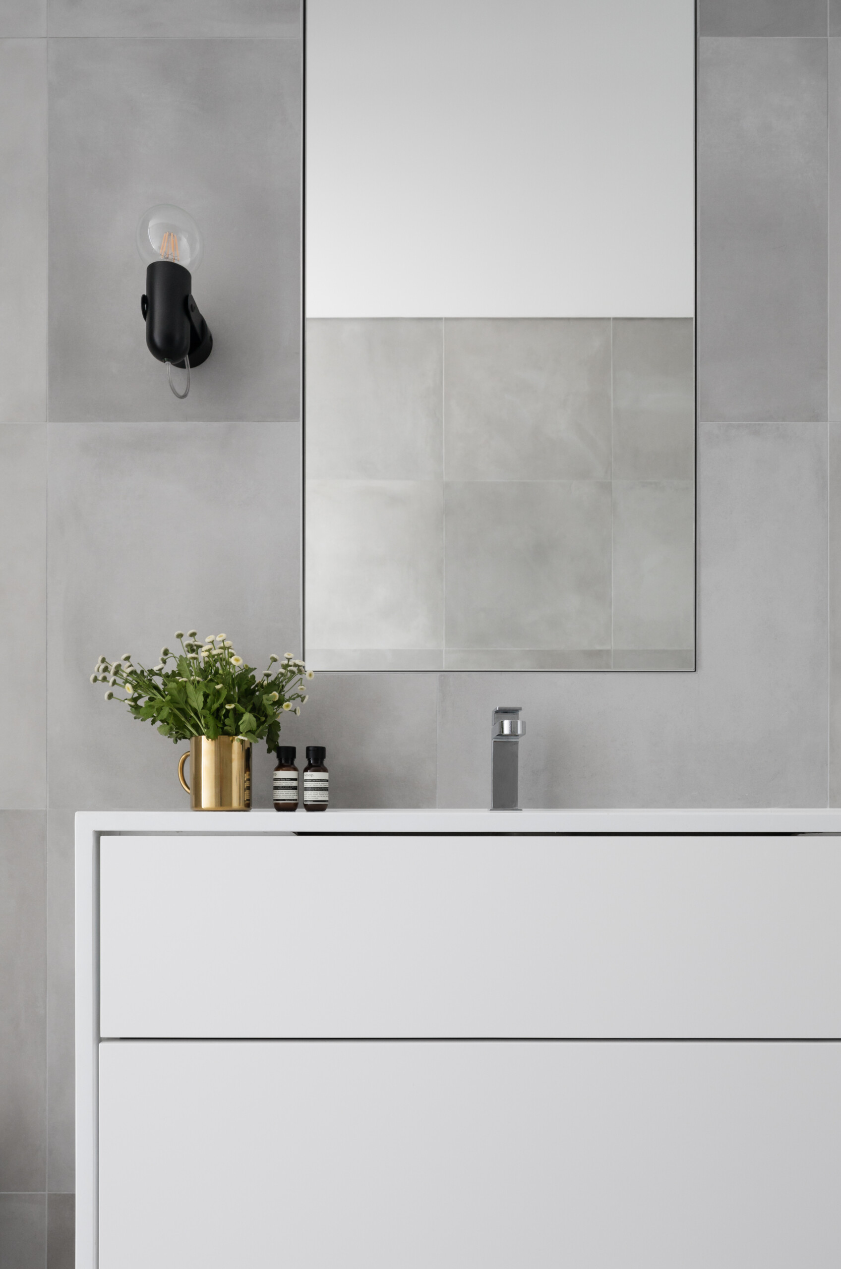 A grey and white bathroom design delivers a calm and modern feel.