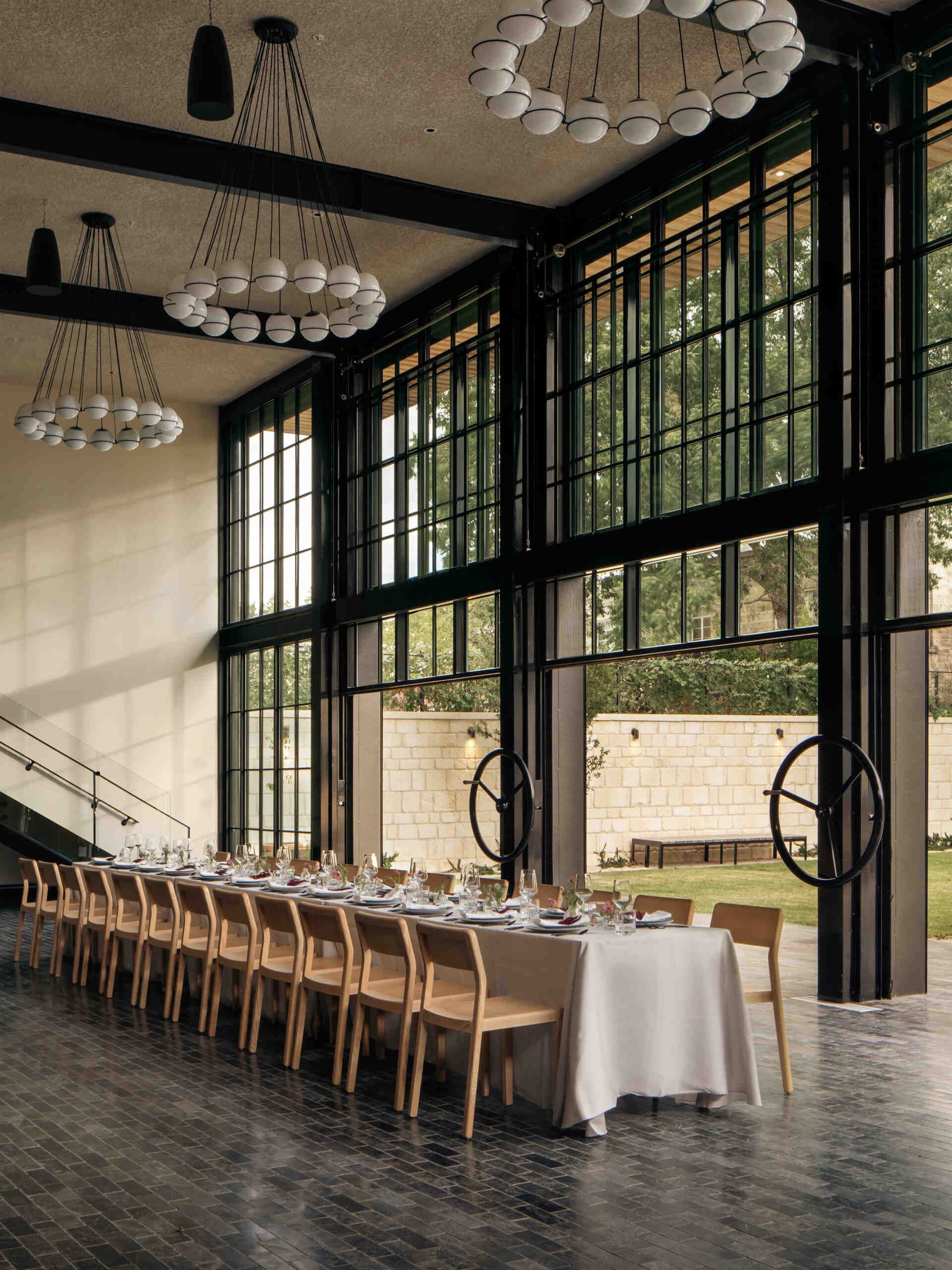 Events are supported by a 3,600 square foot dedicated event space, along with a 1,200 square foot mezzanine deck and an event lawn. These spaces are integrated into the site rather than set apart from it.