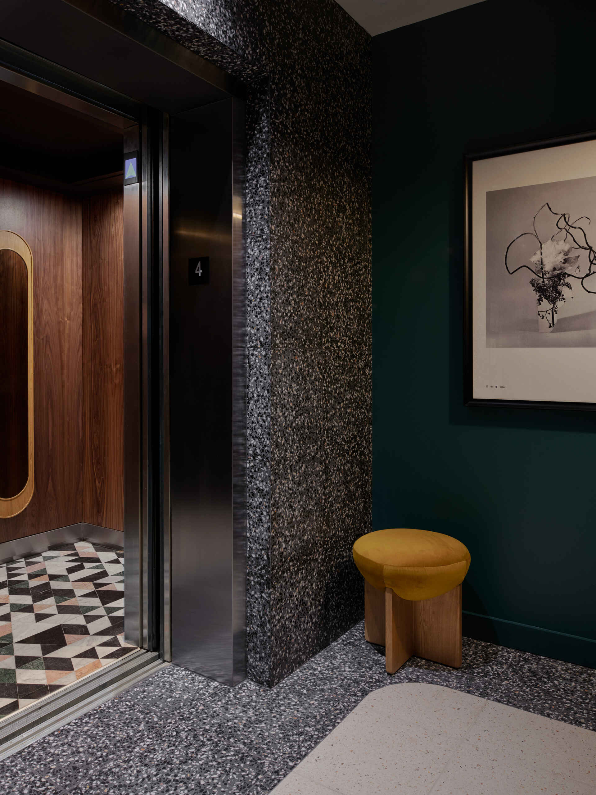 Custom carpets and preserved staircases guide guests from lively public spaces into quieter corridors throughout the hotel.