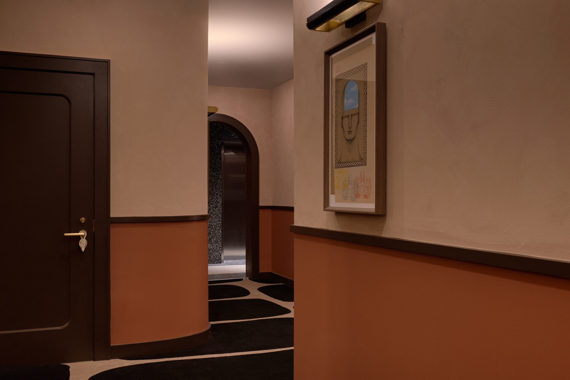 Custom carpets and preserved staircases guide guests from lively public spaces into quieter corridors throughout the hotel.