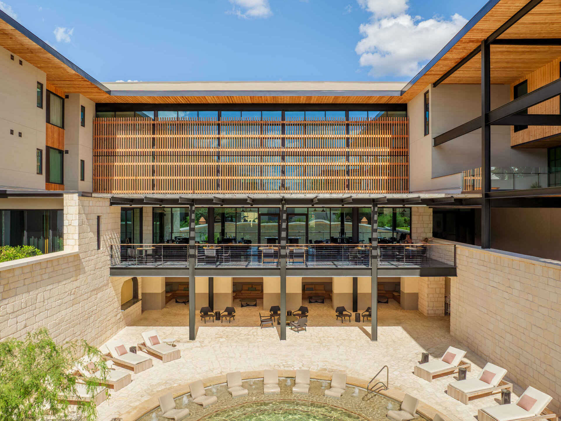 Historic streetfront buildings remain intact while new hotel architecture is quietly positioned behind, preserving the rhythm of downtown Fredericksburg.