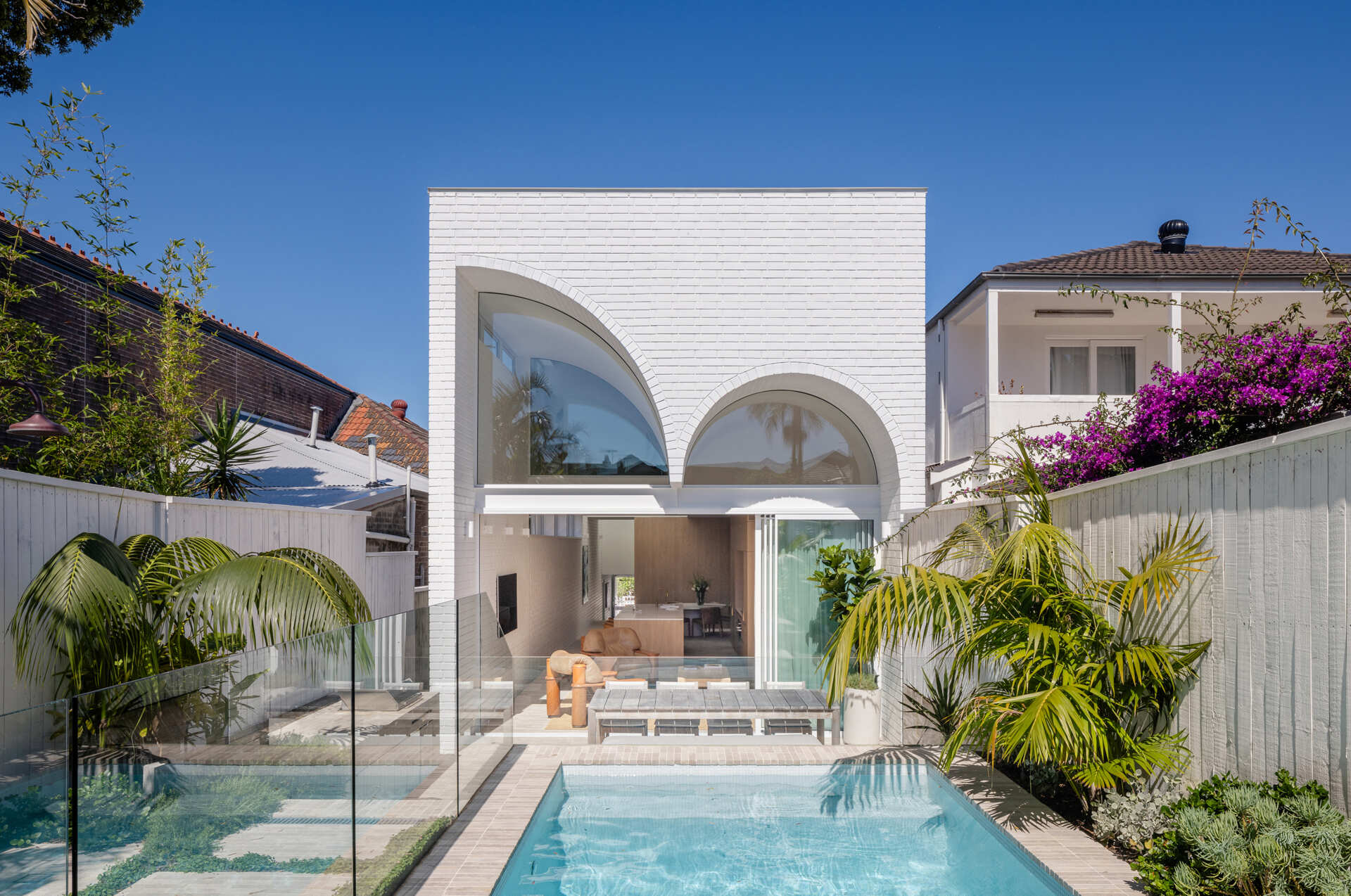 This Sydney home reimagines Federation forms using playful curves, brick volumes and carefully controlled light.