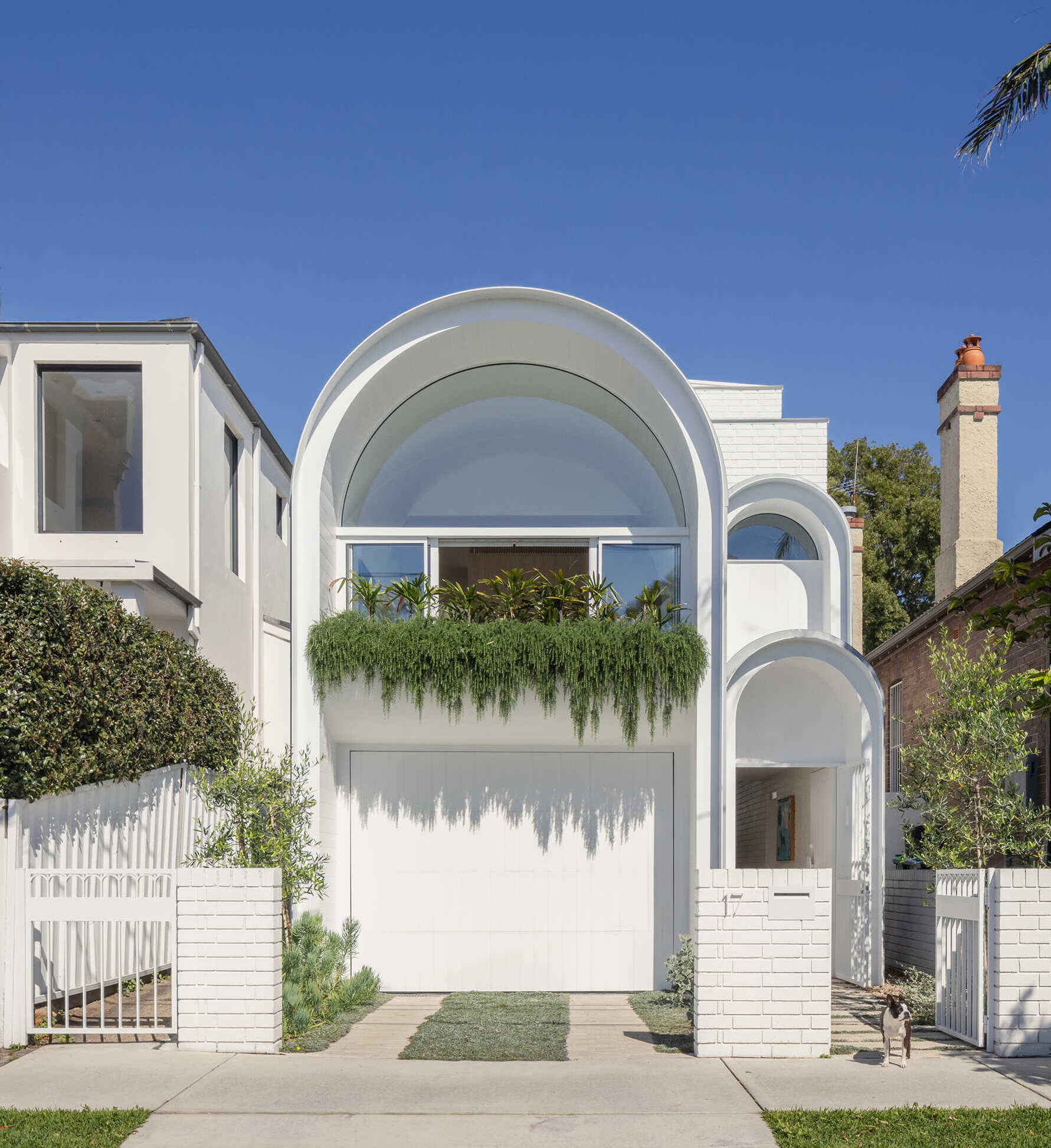 This Sydney home reimagines Federation forms using playful curves, brick volumes and carefully controlled light.