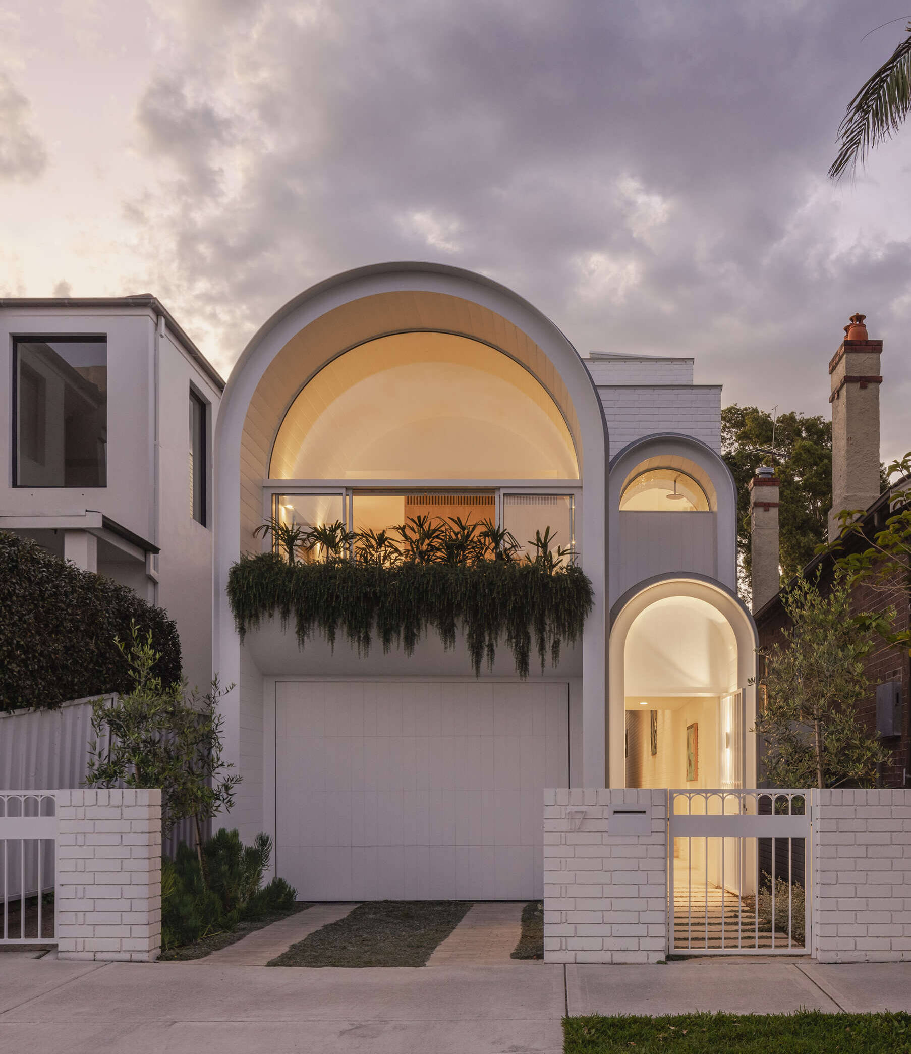 This Sydney home reimagines Federation forms using playful curves, brick volumes and carefully controlled light.