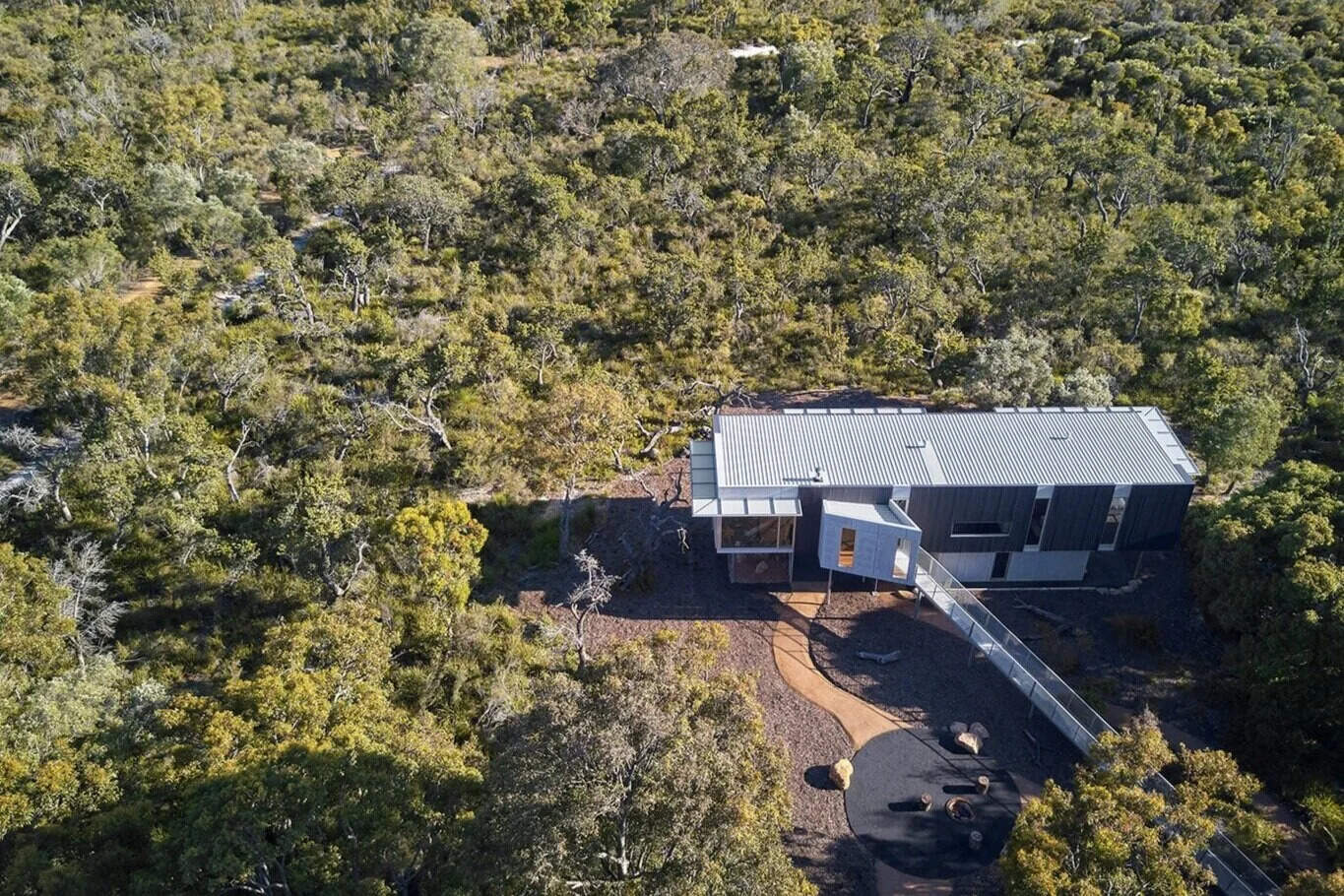 This elevated Australian home is clad in durable, bushfire-resistant finishes of Colorbond, steel, cement and spotted gum.