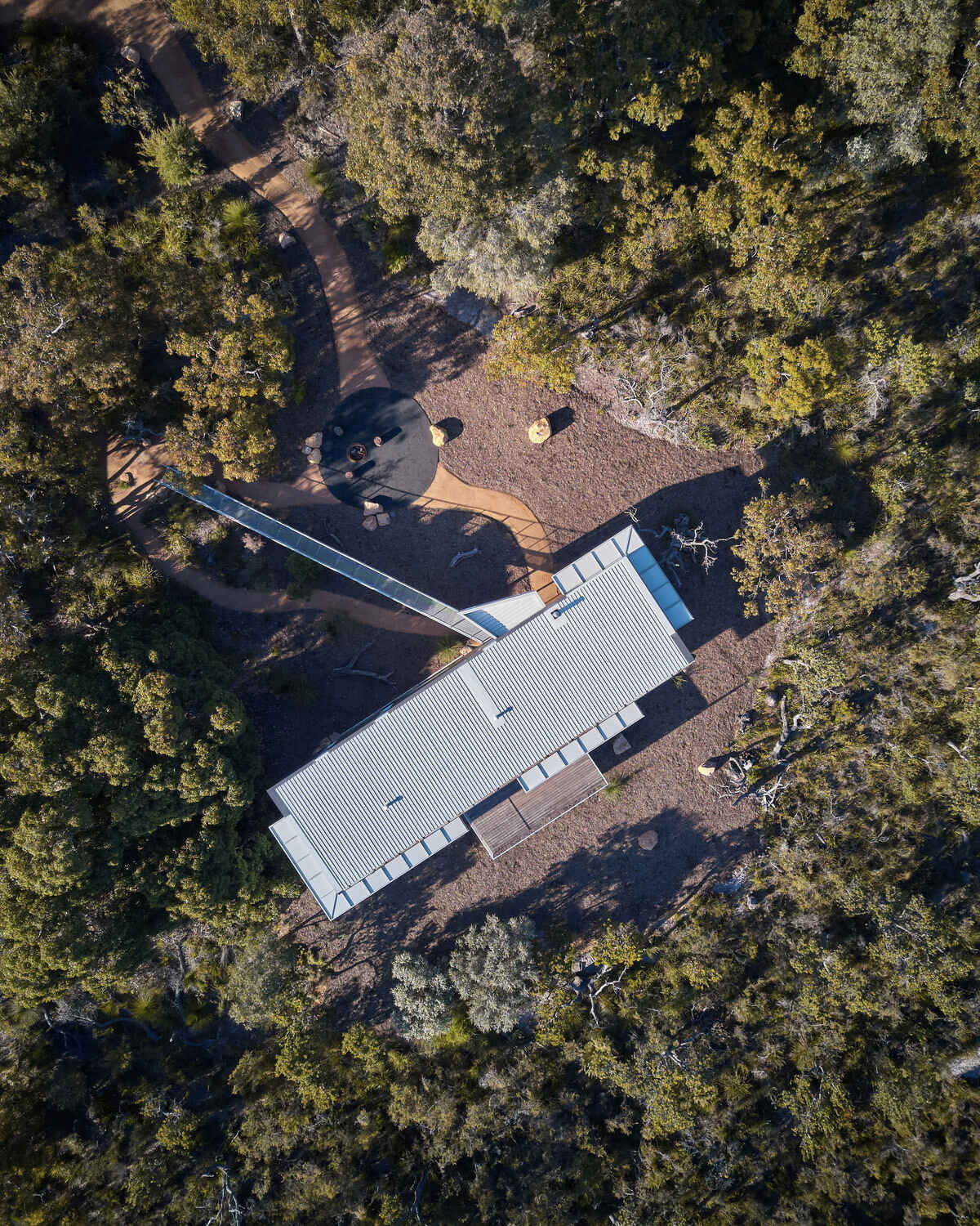 This elevated Australian home is clad in durable, bushfire-resistant finishes of Colorbond, steel, cement and spotted gum.