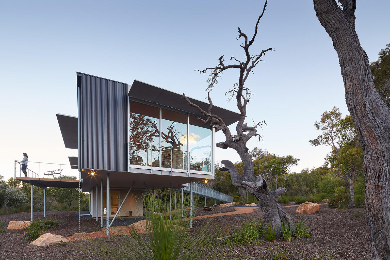 This elevated Australian home is clad in durable, bushfire-resistant finishes of Colorbond, steel, cement and spotted gum.