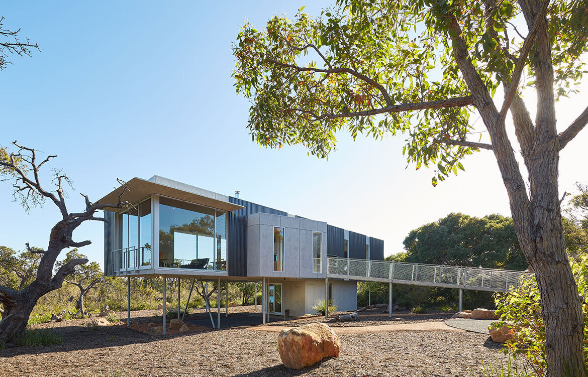 This elevated Australian home is clad in durable, bushfire-resistant finishes of Colorbond, steel, cement and spotted gum.