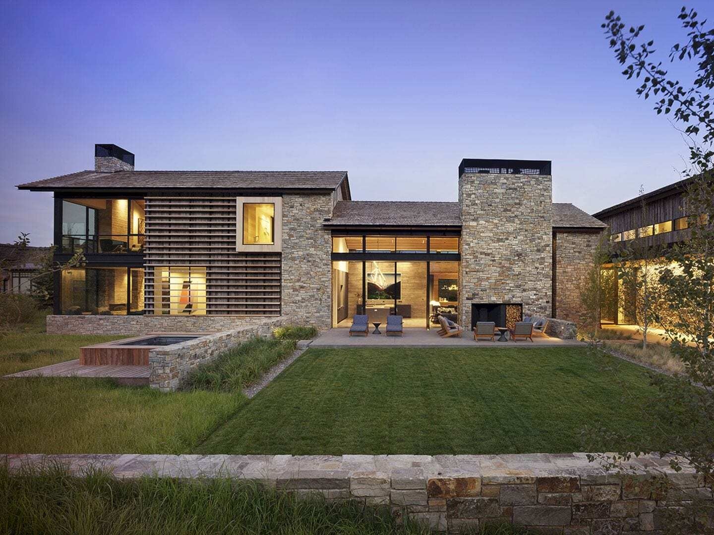 A modern mountain home in Teton Village designed by BMA Architects, combining cedar shingles, reclaimed barn wood and local fieldstone for a refined yet rugged exterior.