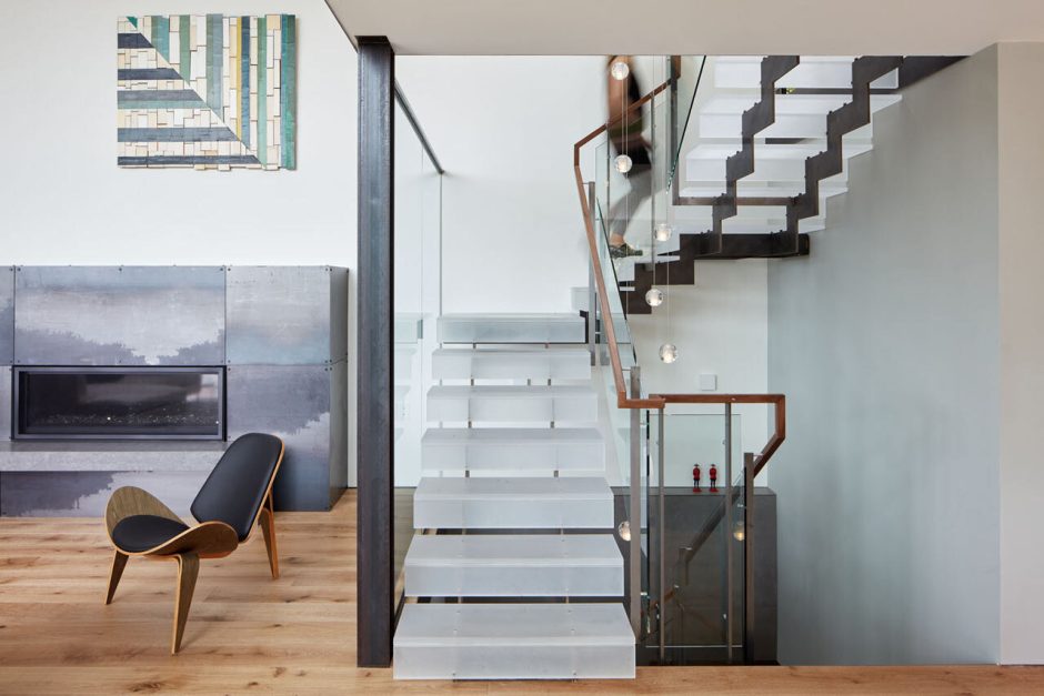 The Hillside House Wrapped in Rusted Steel with a Bright Yellow Surprise