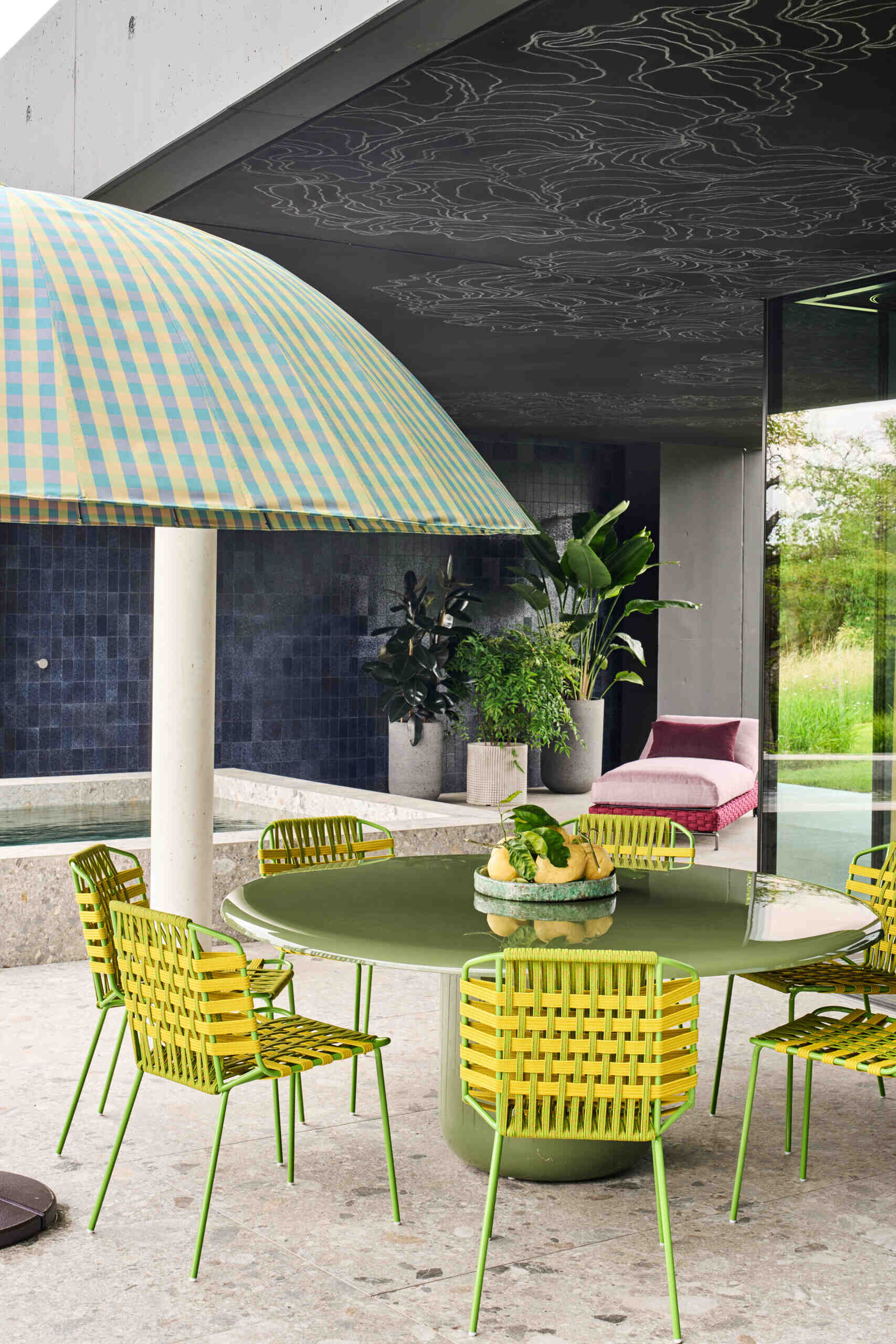 Graphic linework runs from the lounge through to the covered pool area and continues toward the outdoor fire pit, positioned slightly apart from the main volume. The animated lines act as a deliberate counterpoint to the strict geometry of the glass facades and the clear structure of the lap pool.