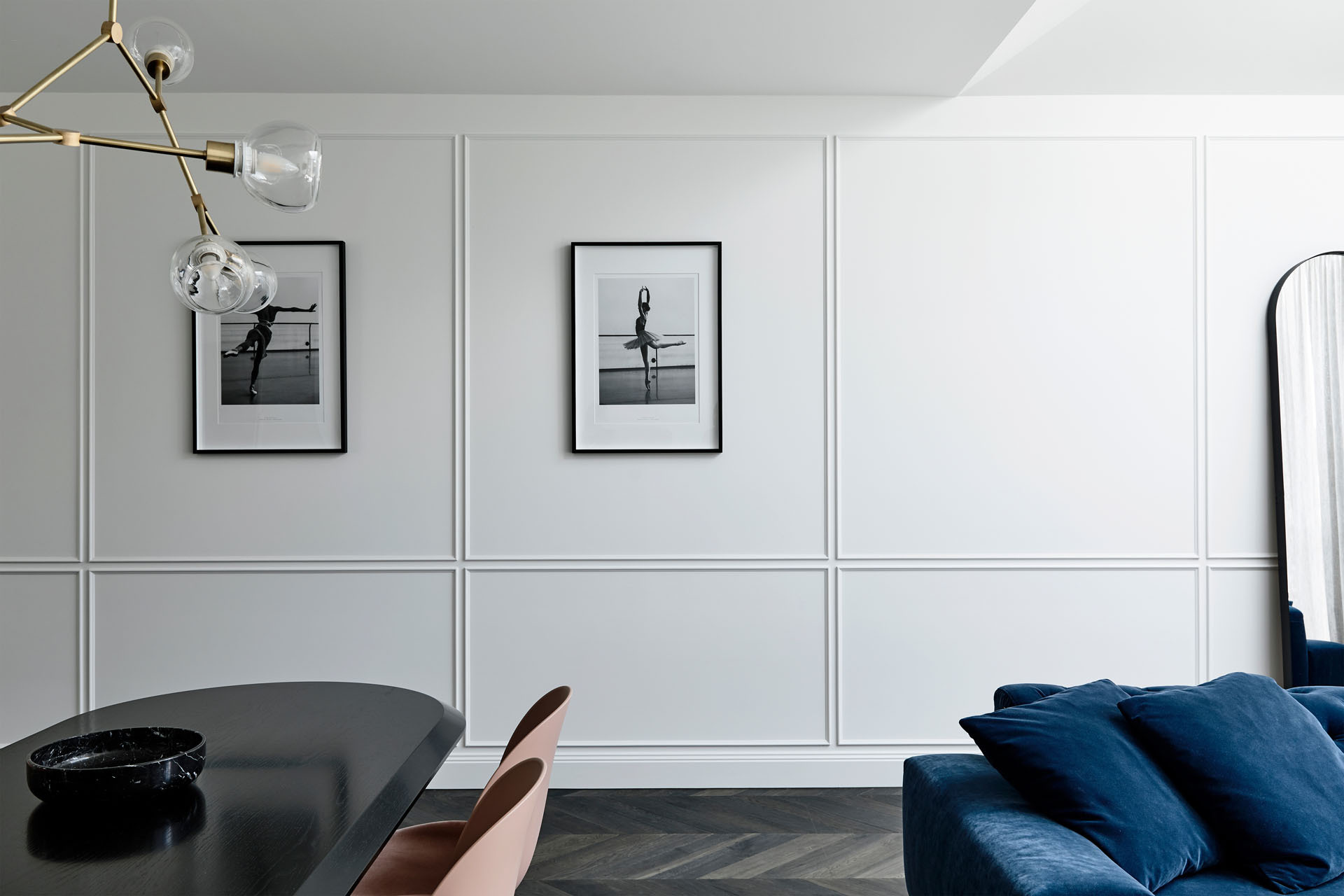 Chevron timber floors and sheer curtains bring softness, warmth and a touch of European elegance to the open living spaces.