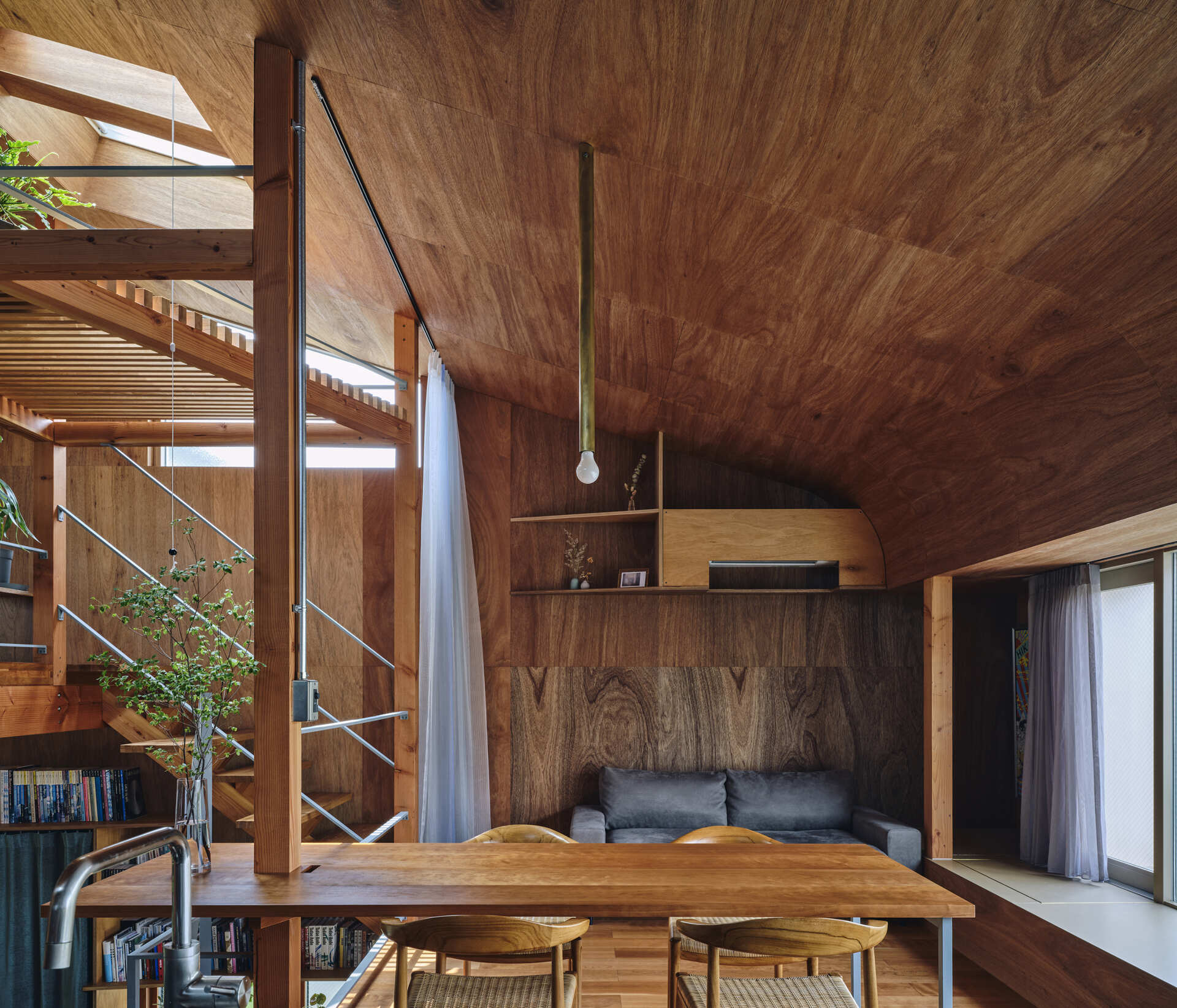 This Tokyo architect’s home shows how everyday life, personal objects, and outdoor space can shape a house that feels open to the city while remaining deeply personal.