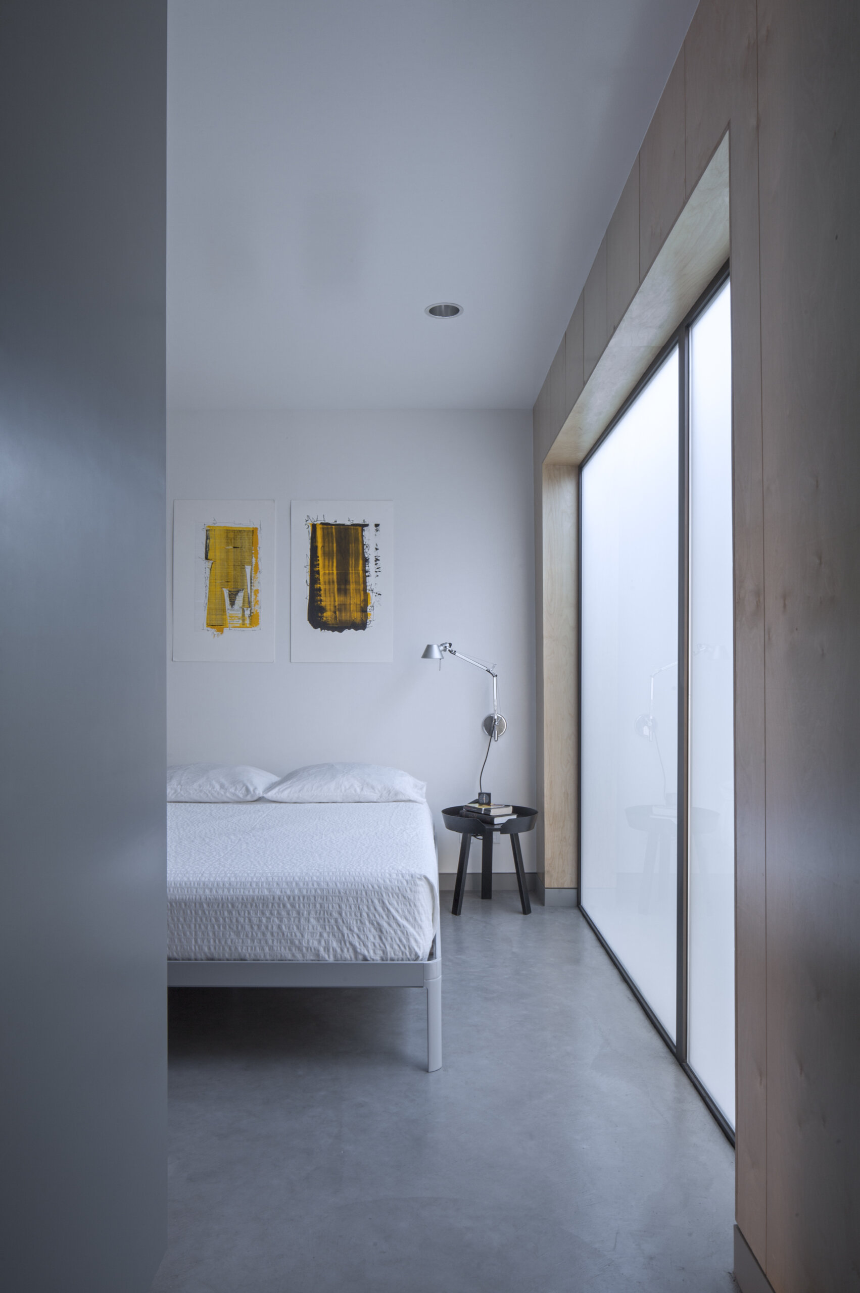Full height hidden storage creates privacy for the bedroom while keeping this 320 sq ft apartment open and uncluttered.