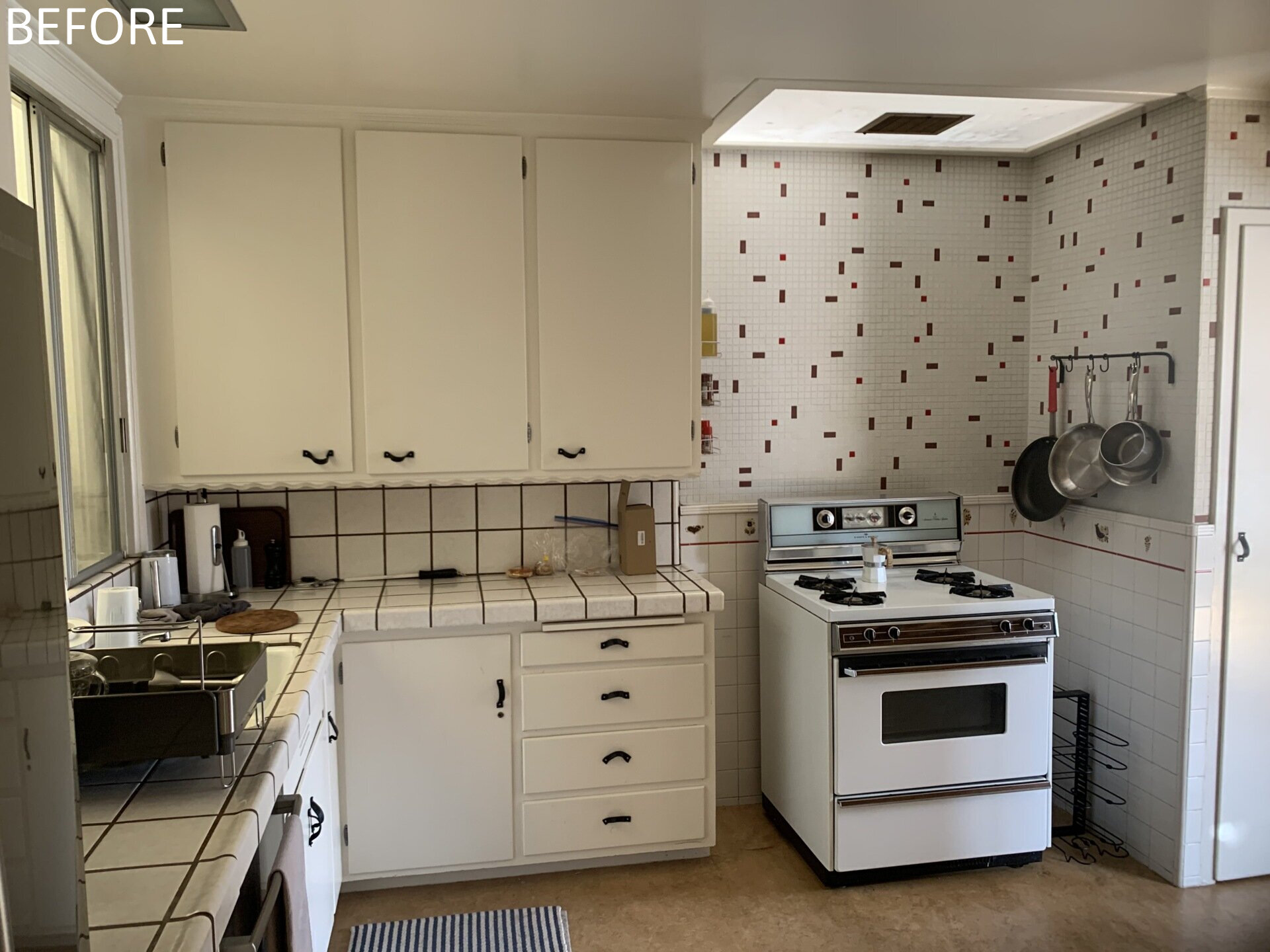 Before, the kitchen was part of the home’s dark and divided interior, lacking a strong relationship to the rest of the living spaces. After the renovation, the kitchen becomes a focal point. A walnut clad island folds geometrically upon itself, inspired by the home’s original 45 degree angled walls.
